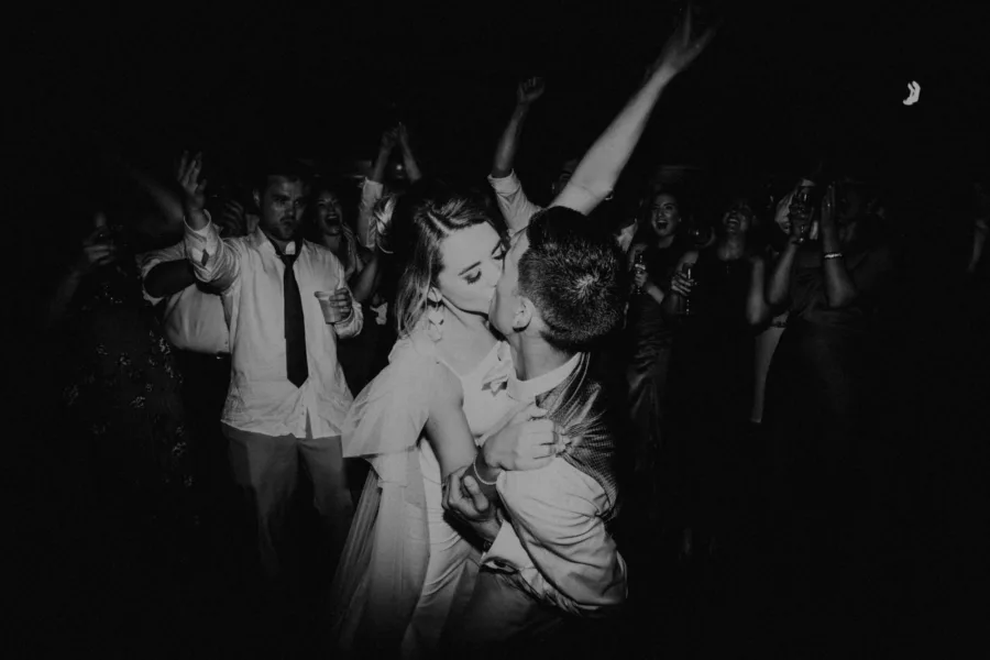 Bride and Groom Dance Floor Kiss Black and White Wedding Portrait