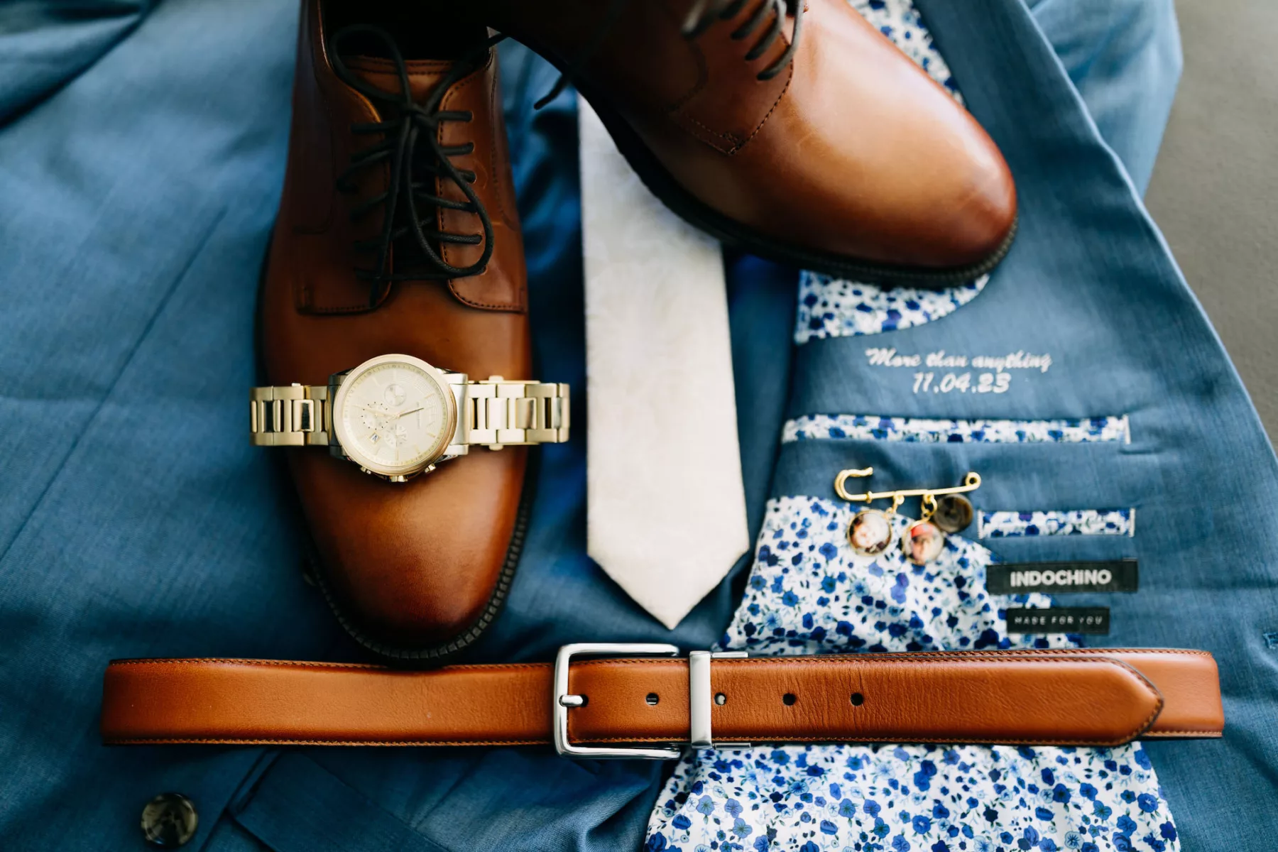 Blue Suit, Brown Shoe, and Belt Groom Attire Ideas | Memorial Wedding Suit Lapel Pin Inspiration