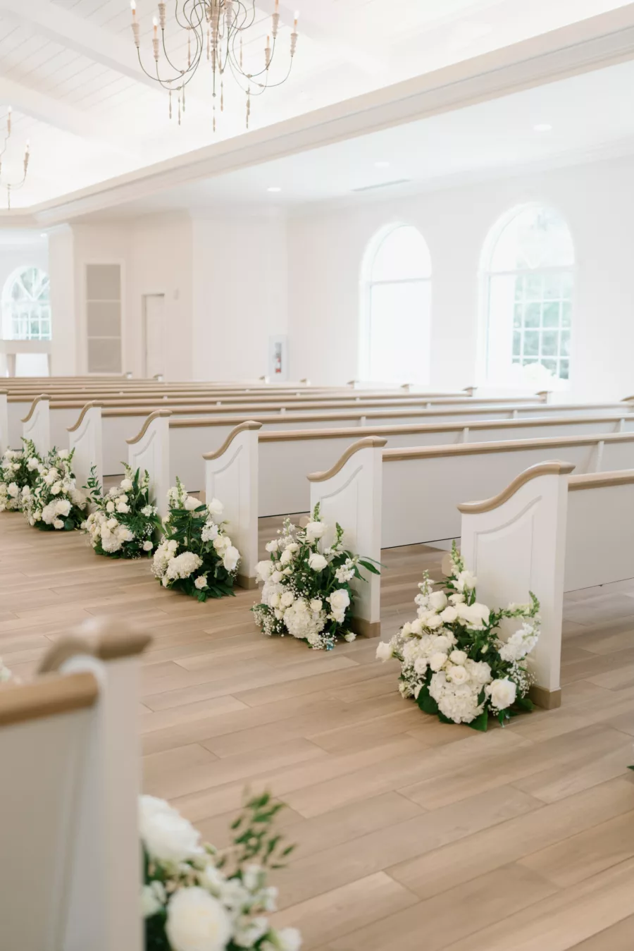 Classic White Wedding Ceremony Aisle Decor Inspiration | White Roses, Baby's Breath, Hydrangeas, and Greenery Flower Arrangement Ideas | Tampa Wedding Venue Harborside Chapel