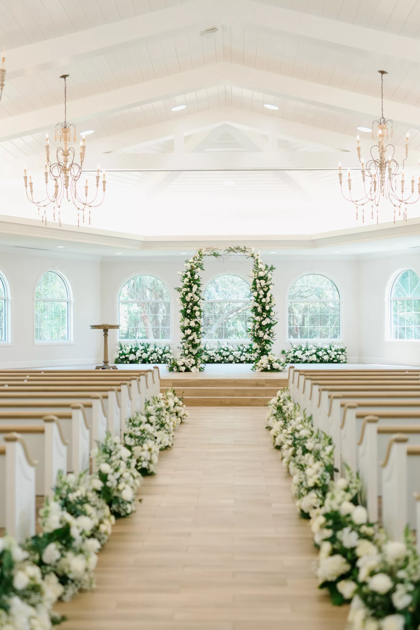 Classic White Wedding Ceremony Aisle Decor Inspiration | White Roses, Baby's Breath, Hydrangeas, and Greenery Flower Arrangement Ideas | Tampa Bay Event Venue Harborside Chapel