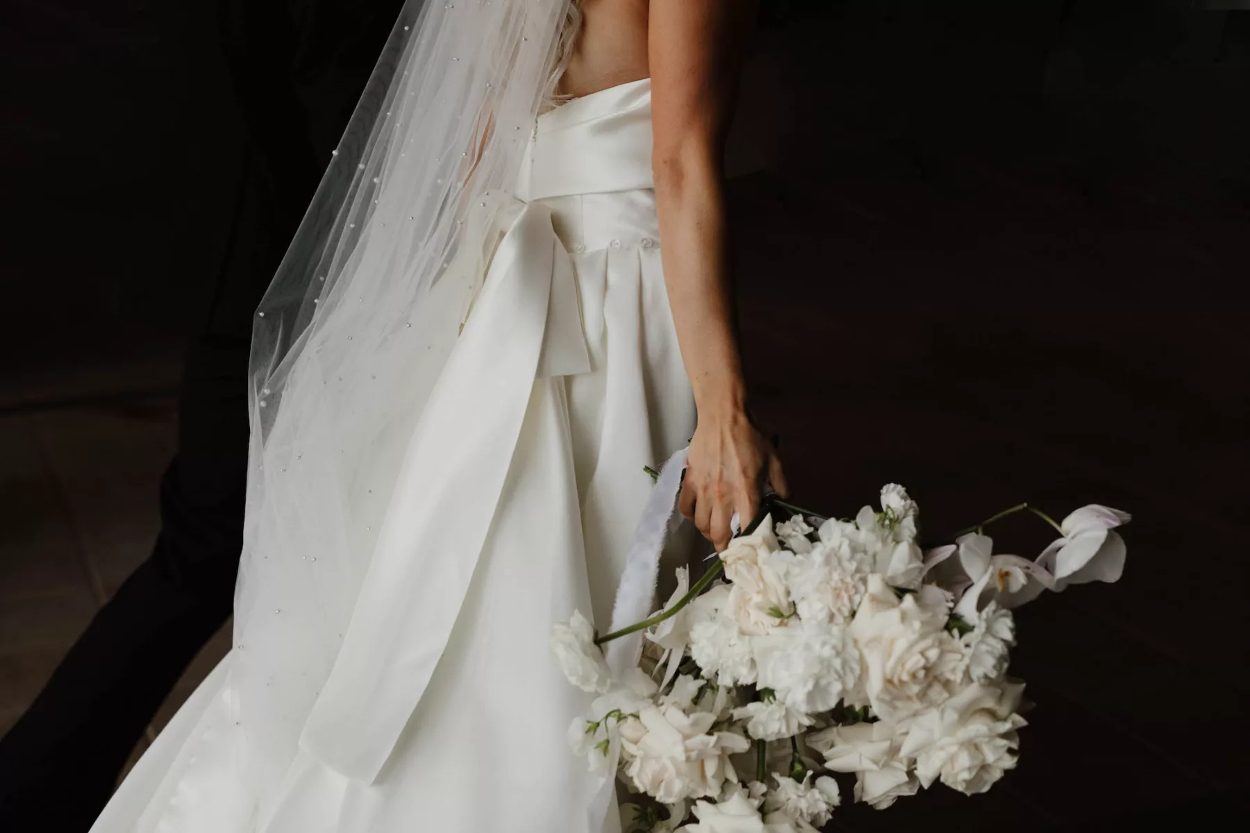 White Orchid and Rose Bridal Bouquet Ideas | Elegant Strapless Satin A-Line Eva Lendel Wedding Dress with Bow and Pearl Veil Inspiration