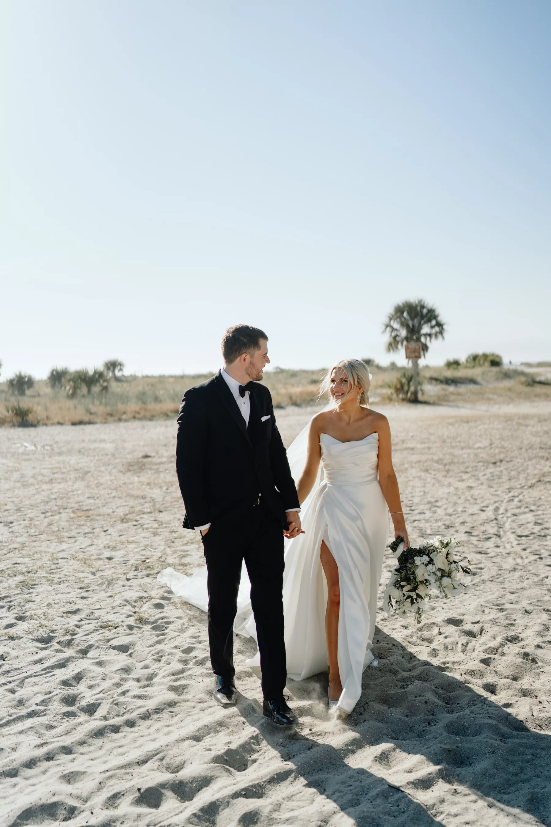 Bride and Groom Walking on Clearwater Beach Wedding Portrait | Tampa Bay Photographer and Videographer J&S Media