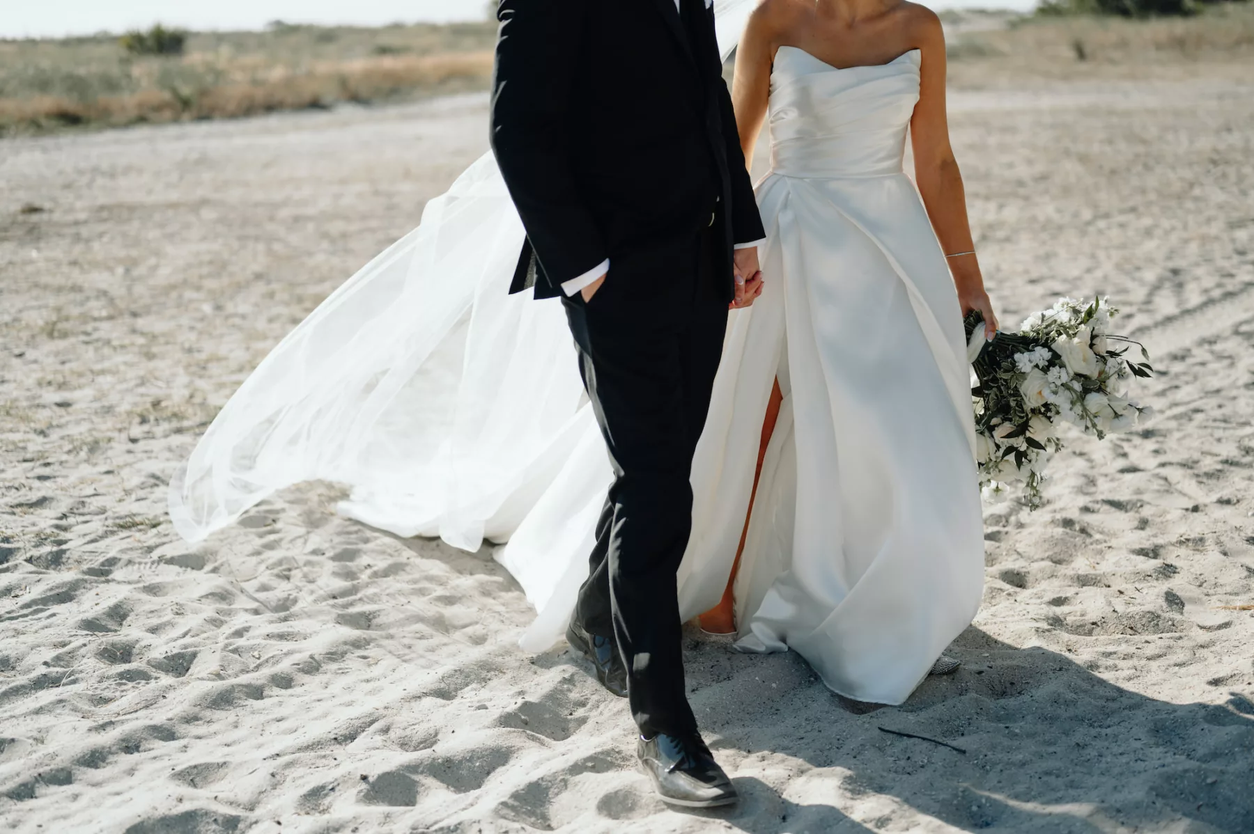 Bride and Groom Walking on Clearwater Beach Wedding Portrait