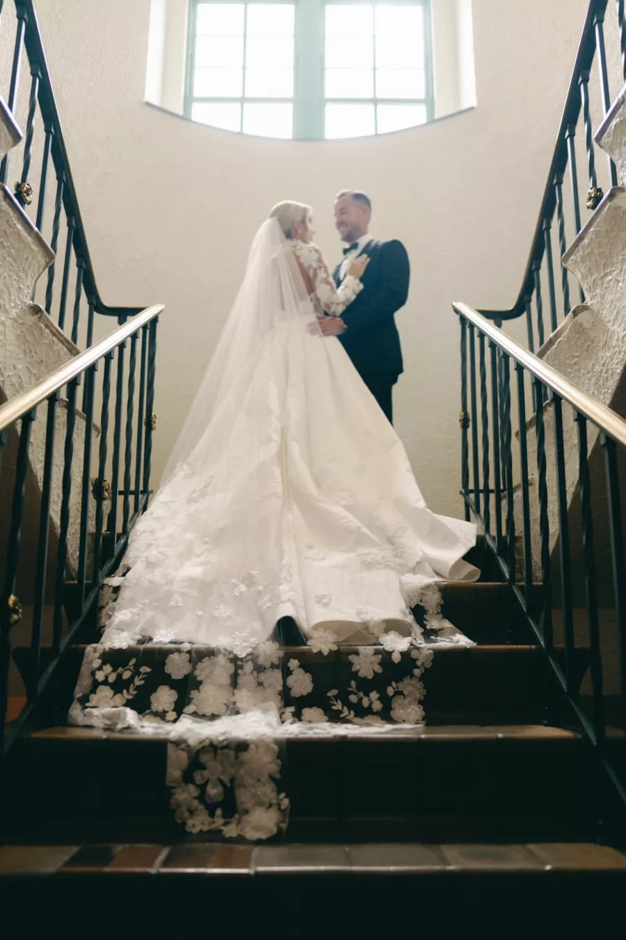 Intimate Bride and Groom First Look Wedding Portrait | Long Sleeve Embroidered Flower Fit and Flare Anne Barge Solana Wedding Dress with Detachable Train Inspiration | St Pete Historic Hotel Venue The Vinoy