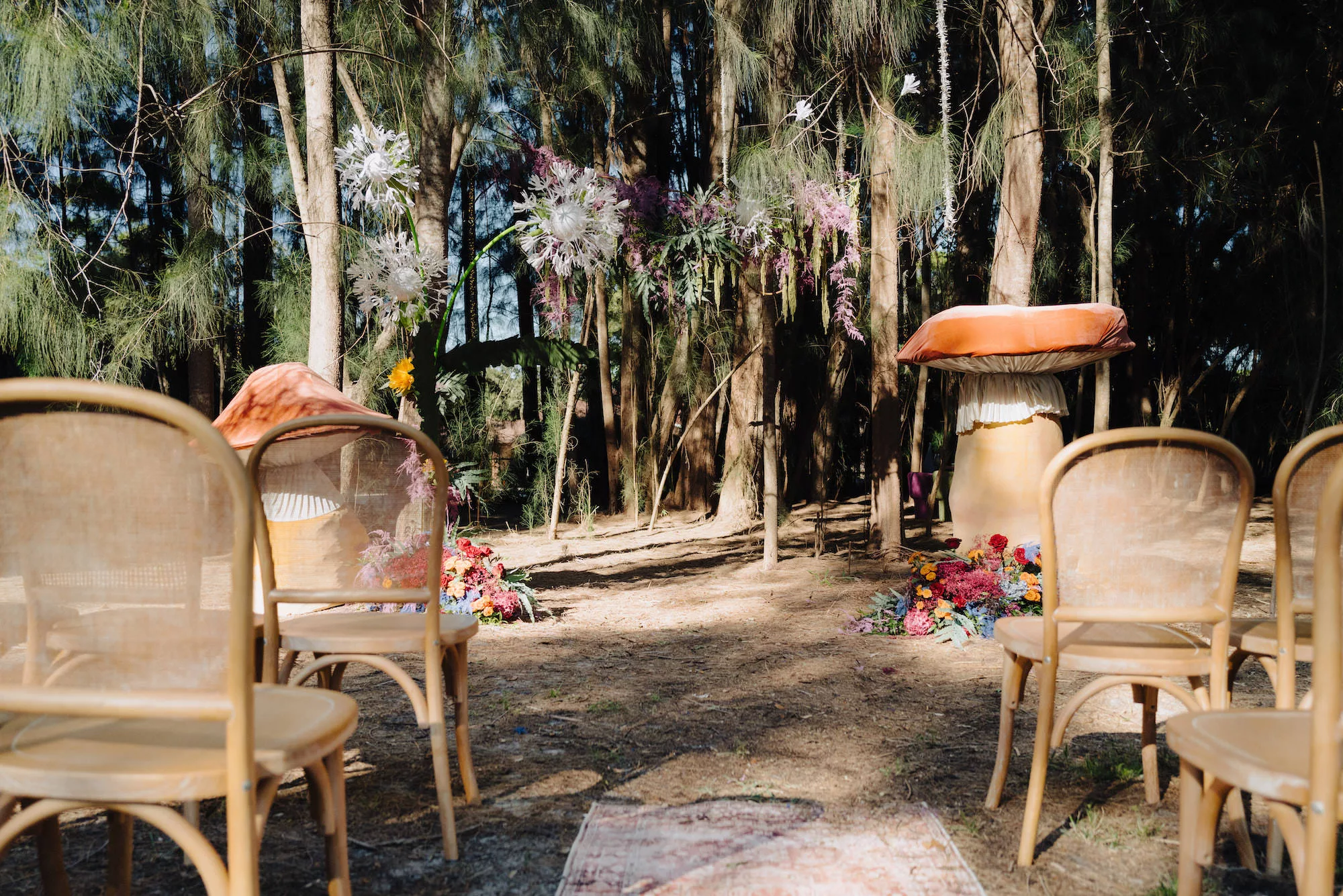 Whimsical Boho Forest Wedding Ceremony Flower Ideas | Mushroom Altar Decor Ideas with Rattan Chairs