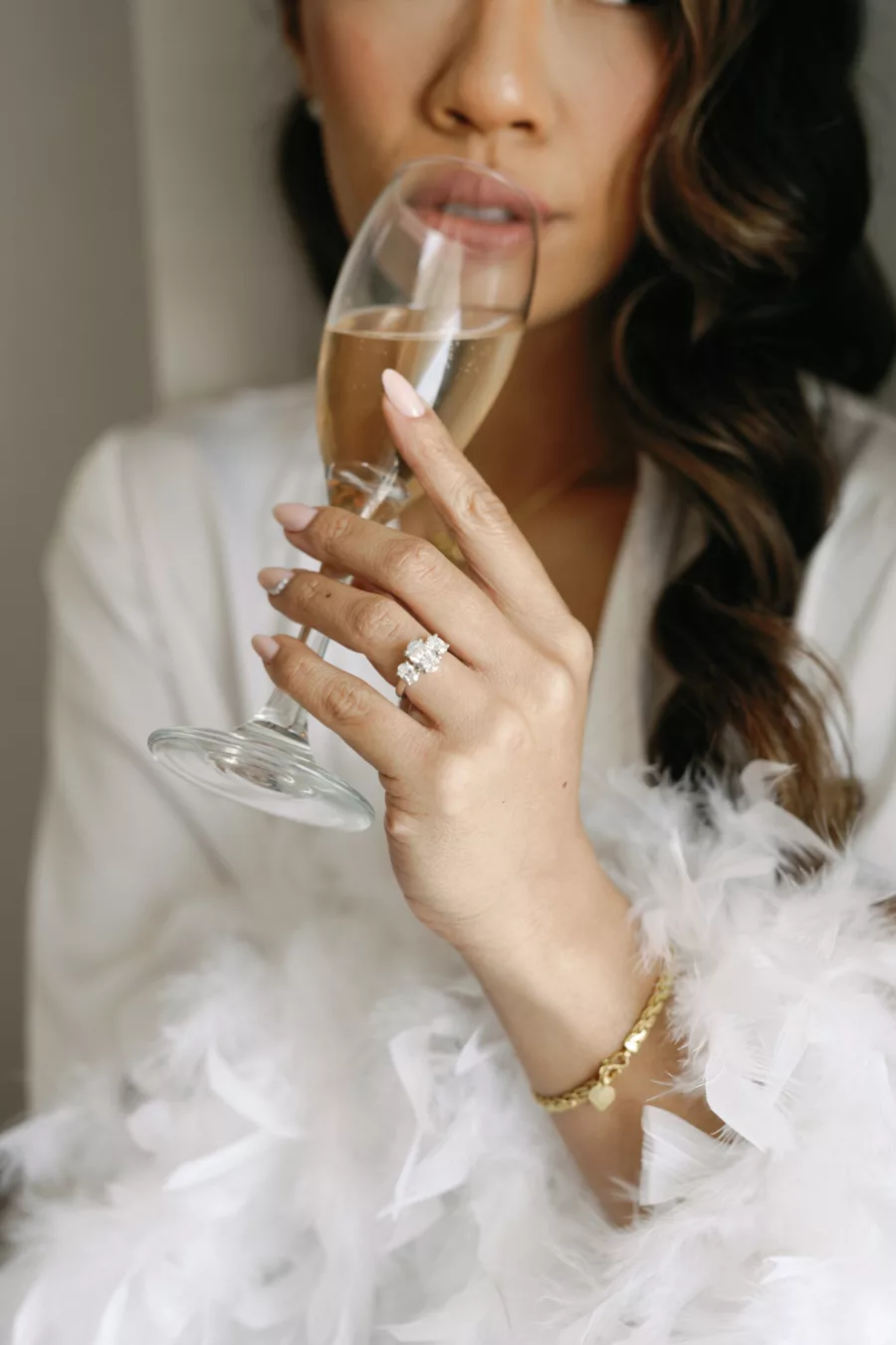 Three Stone Oval Engagement Ring | Wedding Day Robe with Feathers Inspiration | Tampa Bay Hair and Makeup Artist Femme Akoi Beauty Studio | Photographer Dewitt for Love Photography