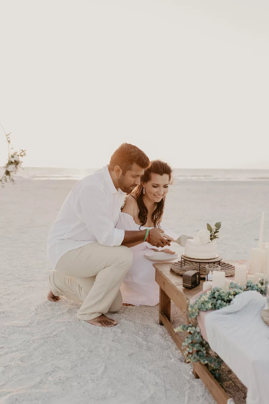 Bride and Groom Cutting Wedding Cake for Beach Elopement
