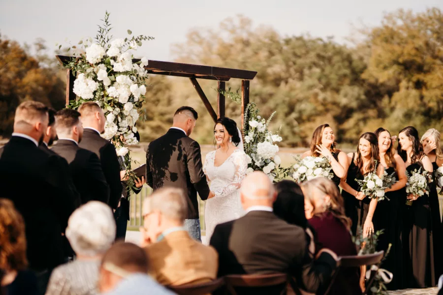 Rustic Wooden Wedding Ceremony Arch with White Roses, Hydrangeas, and Greenery Decor Ideas | Venue Simpson Lakes