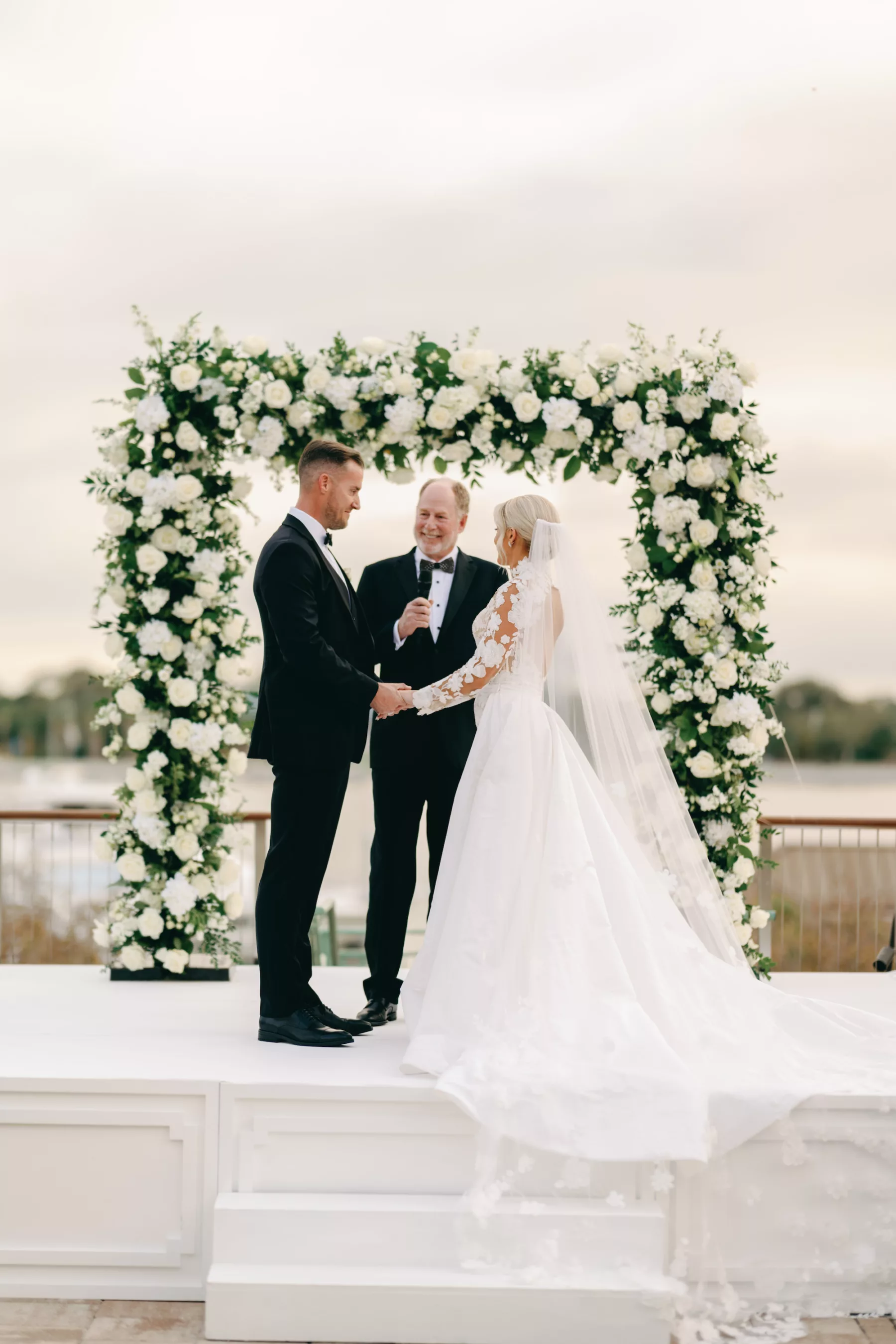White Roses and Greenery Wedding Ceremony Altar Arch and Stage Decor Ideas | St Pete Historic Hotel Venue The Vinoy