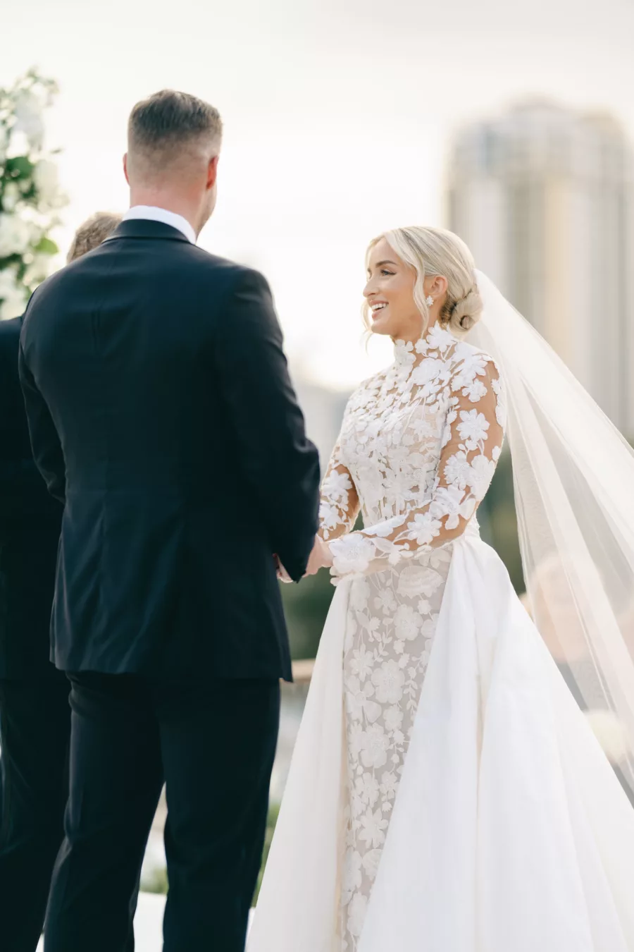 Romantic Bride and Groom Just Married Wedding Portrait | Long Sleeve Embroidered Flower Fit and Flare Anne Barge Solana Wedding Dress with Detachable Train Inspiration