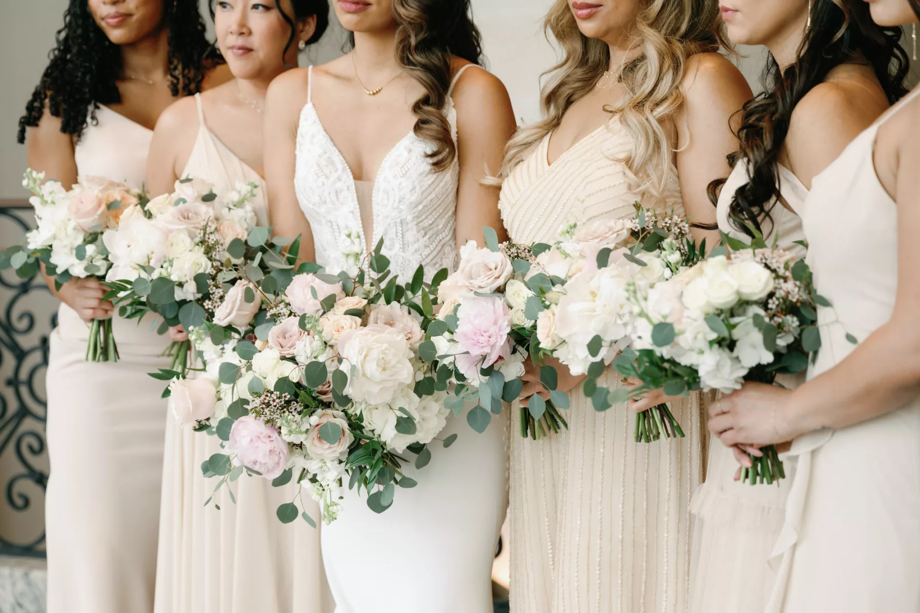 Spring Wedding Bouquet Inspiration with White Roses, Pink Garden Roses, Wax Flowers, Peony, and Greenery | Neutral Cream Mismatched Bridesmaid Dress Ideas | Tampa Bay Florist Marigold Flower Co