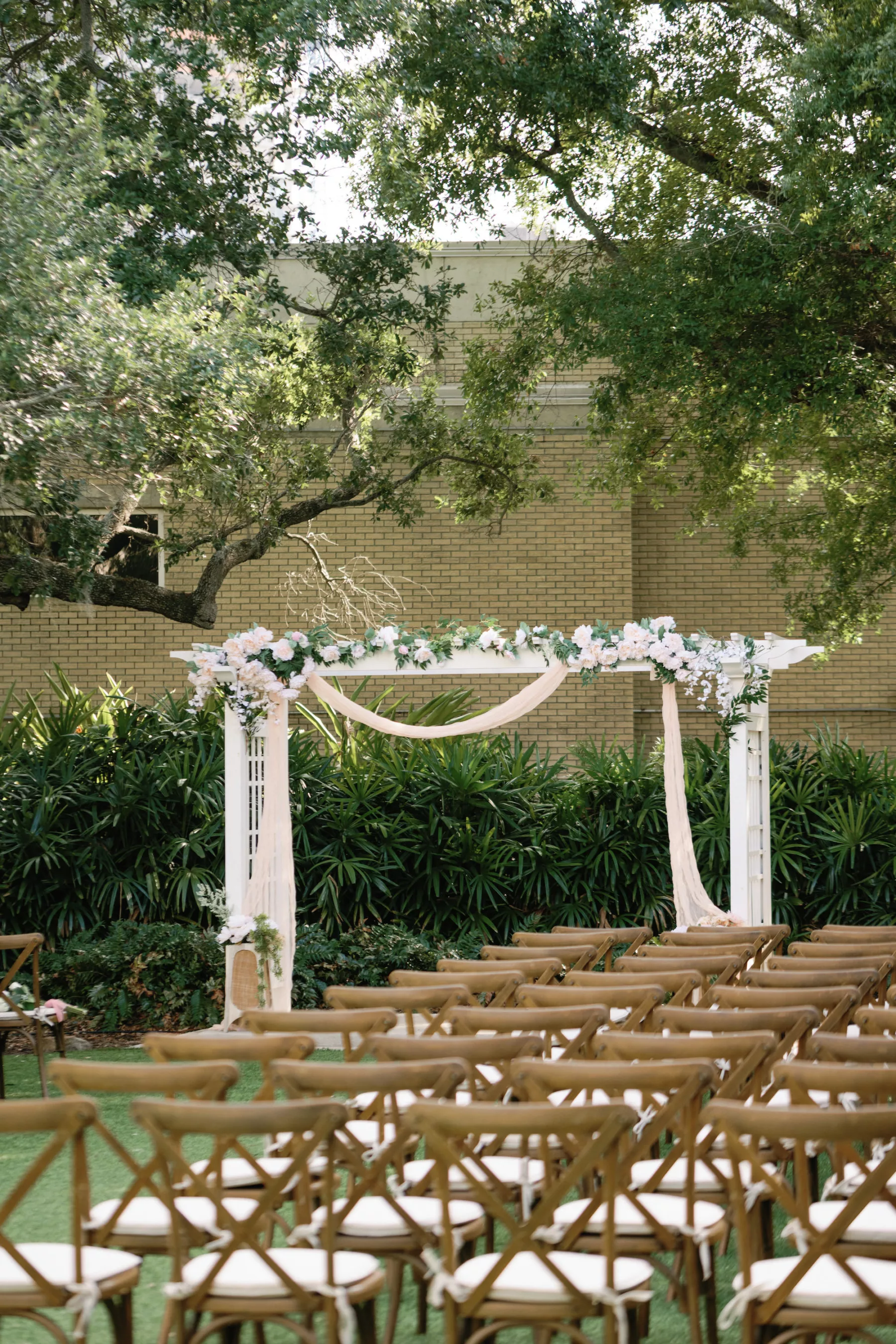 Outdoor Vintage Wedding Garden Ceremony with White Pergola Altar and Crossback Chairs Inspiration