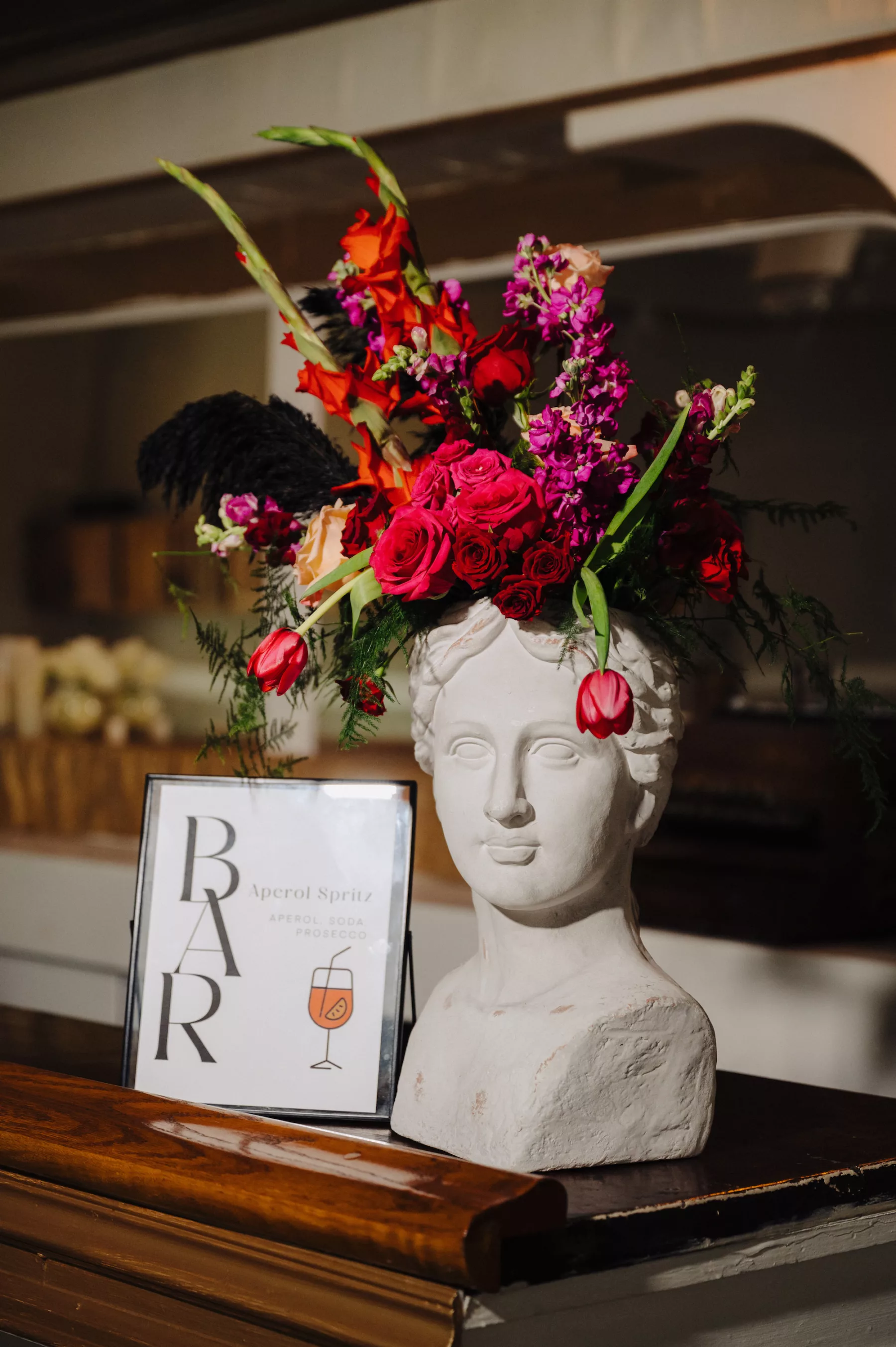 Modern Wedding Reception Bar Decor Ideas | Bust with Pink and Red Roses, Black Pampas Grass, and Greenery Flower Arrangement Inspiration | Tampa Bay Florist Save The Date Florida
