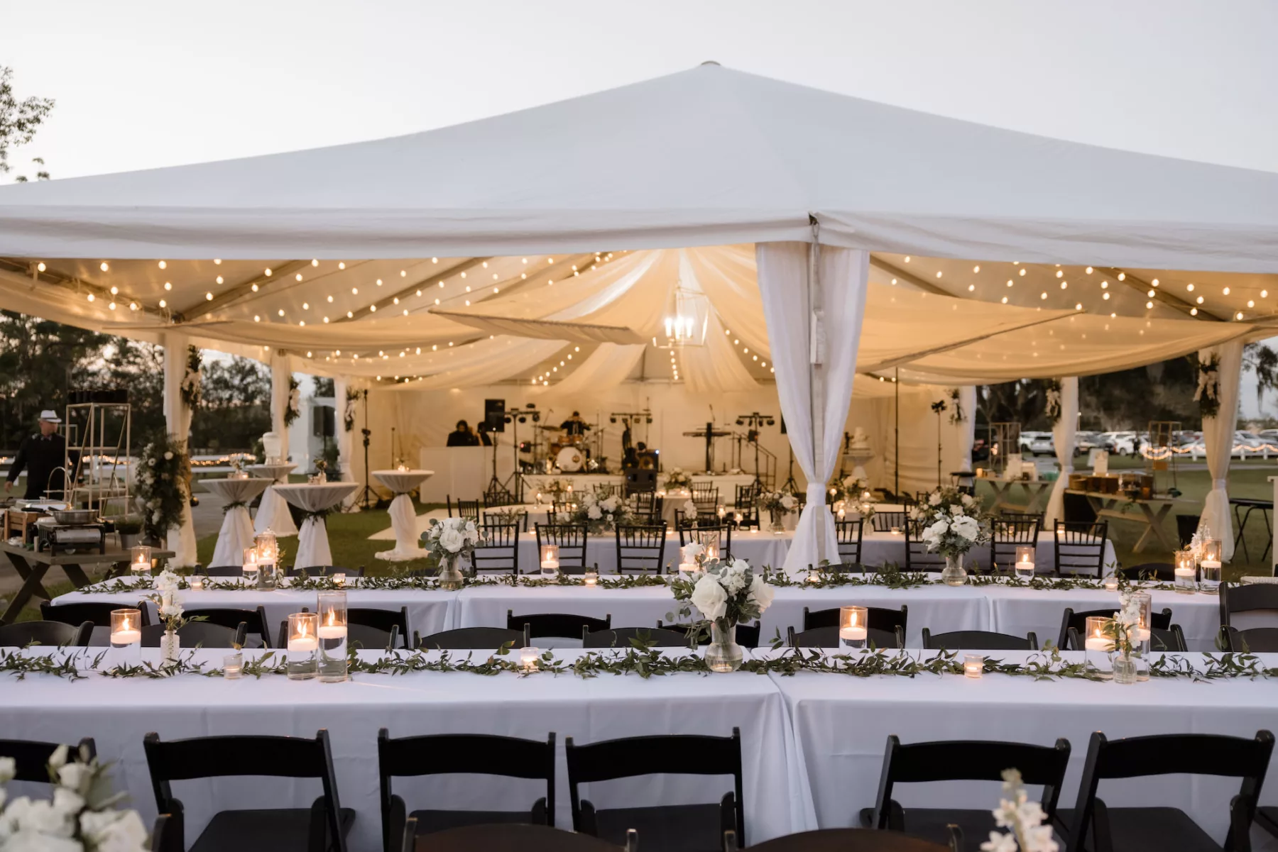 Timeless White and Black Tented Fall Wedding Reception Inspiration | Long Feasting Tables and Greenery Garland Centerpiece Decor Ideas