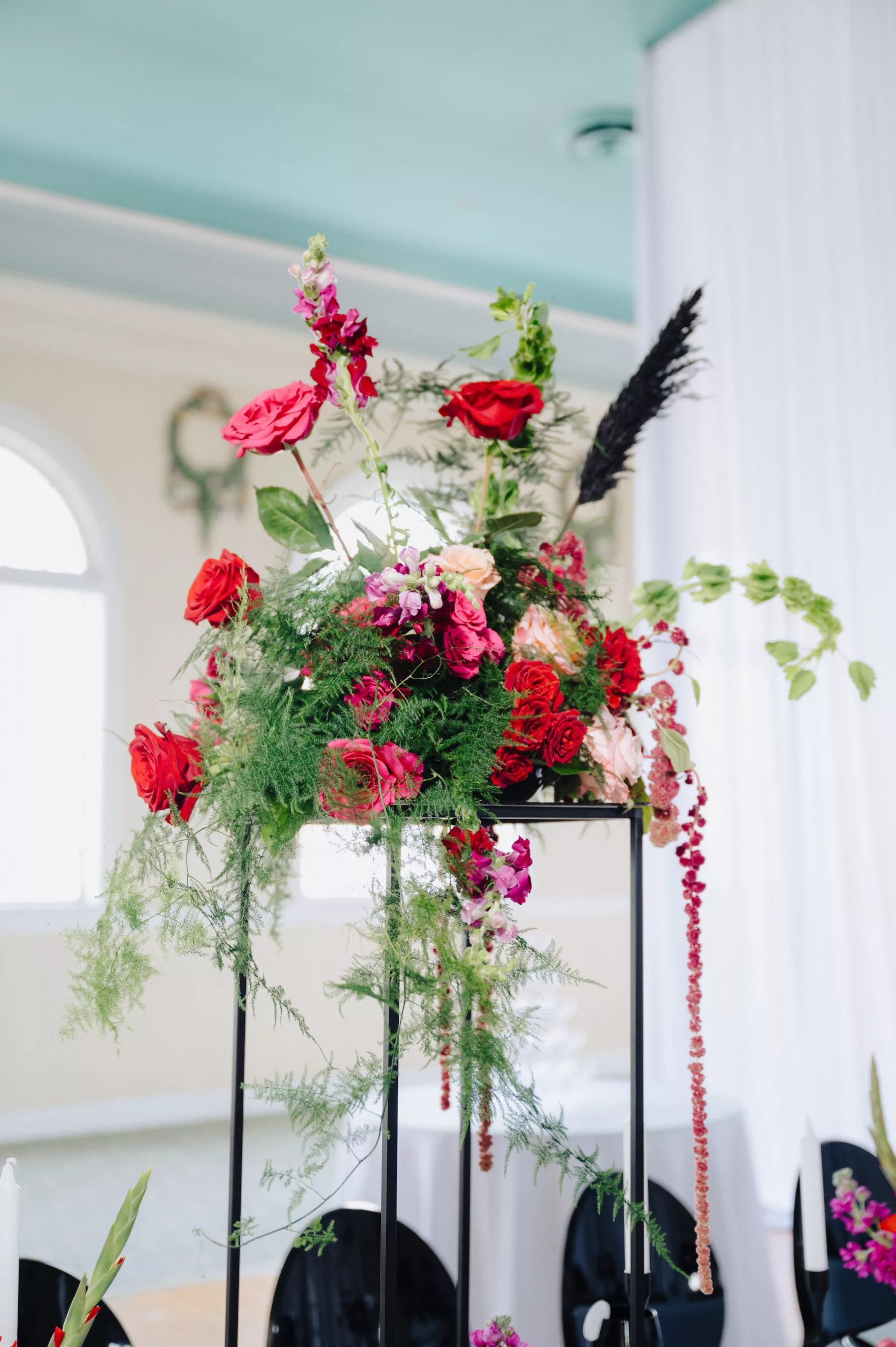Tall Modern Black Flower Stand with Red and Pink Roses, Greenery, and Black Pampas Grass Wedding Reception Centerpiece Decor Ideas | Ybor Florist Save The Date Florida