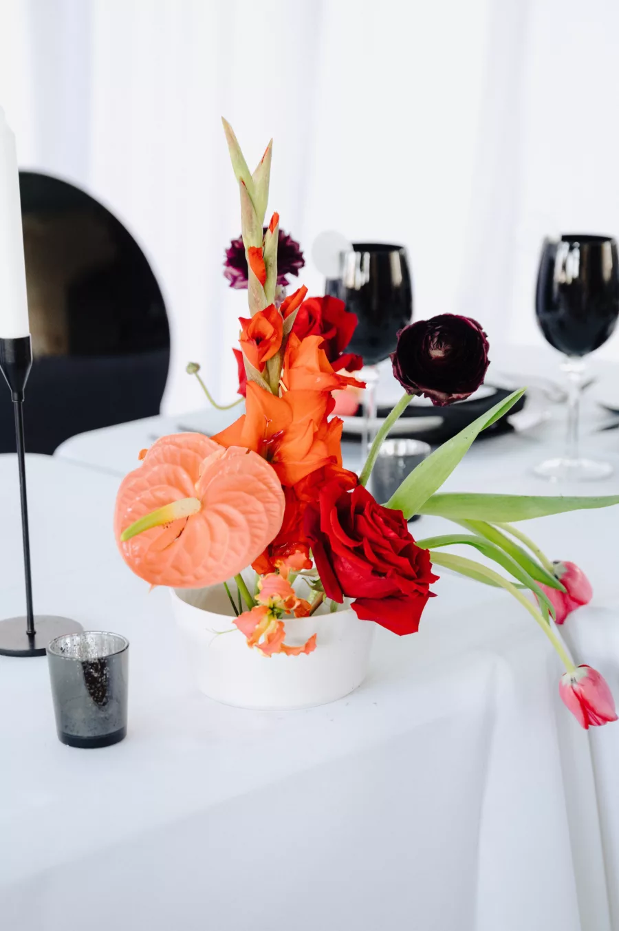 Modern Spring Wedding Reception Decor Inspiration | Tabletop Floral Arrangement with Orange Anthurium, Birds of Paradise, Pink Tulips, and Red Roses | Tampa Bay Florist Save The Date Florida
