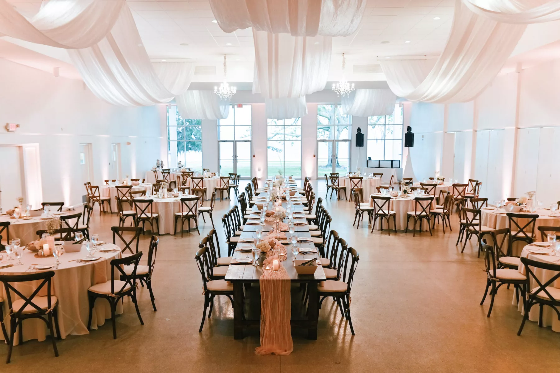 Neutral Vintage Indoor Wedding Reception Ideas | White Drapery, Wooden Crossback Chairs and Long Feasting Table Inspiration | Event Venue Tampa Garden Club