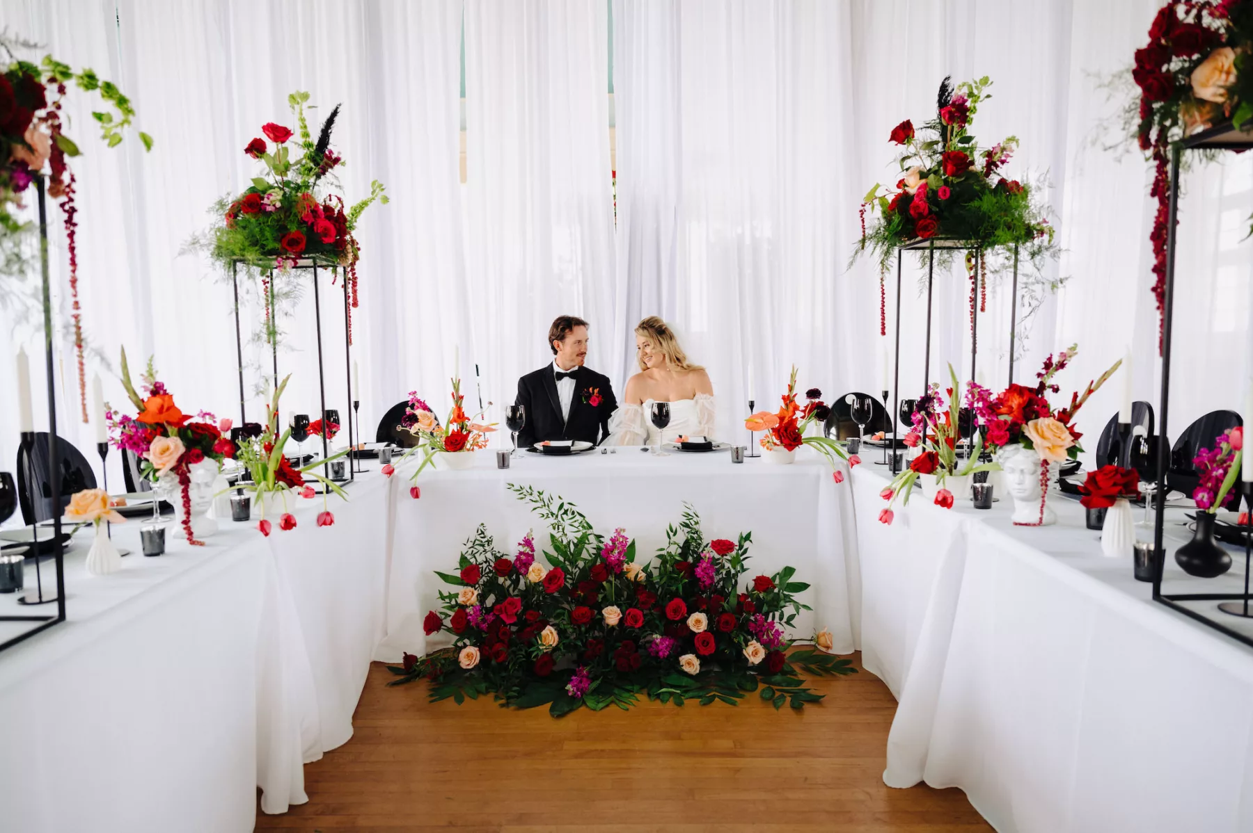 Modern Black and Pink Italian Inspired Wedding Reception | U-Shaped Table Setting | Greenery, Pink and Red Rose Flower Arrangement Decor Ideas | Tampa Bay Florist Save The Date Florida | Ybor Event Planner Eventfull Weddings | Venue Cuban Club
