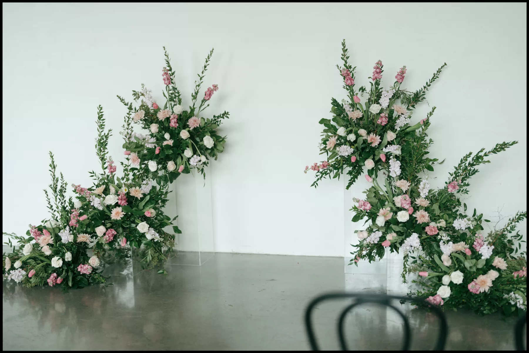 Whimsical Pink and White Roses, Chrysanthemums, Tulips, and Greenery Floral Arrangement Wedding Ceremony Backdrop Inspiration | Tampa Bay Florist Save The Date Florida