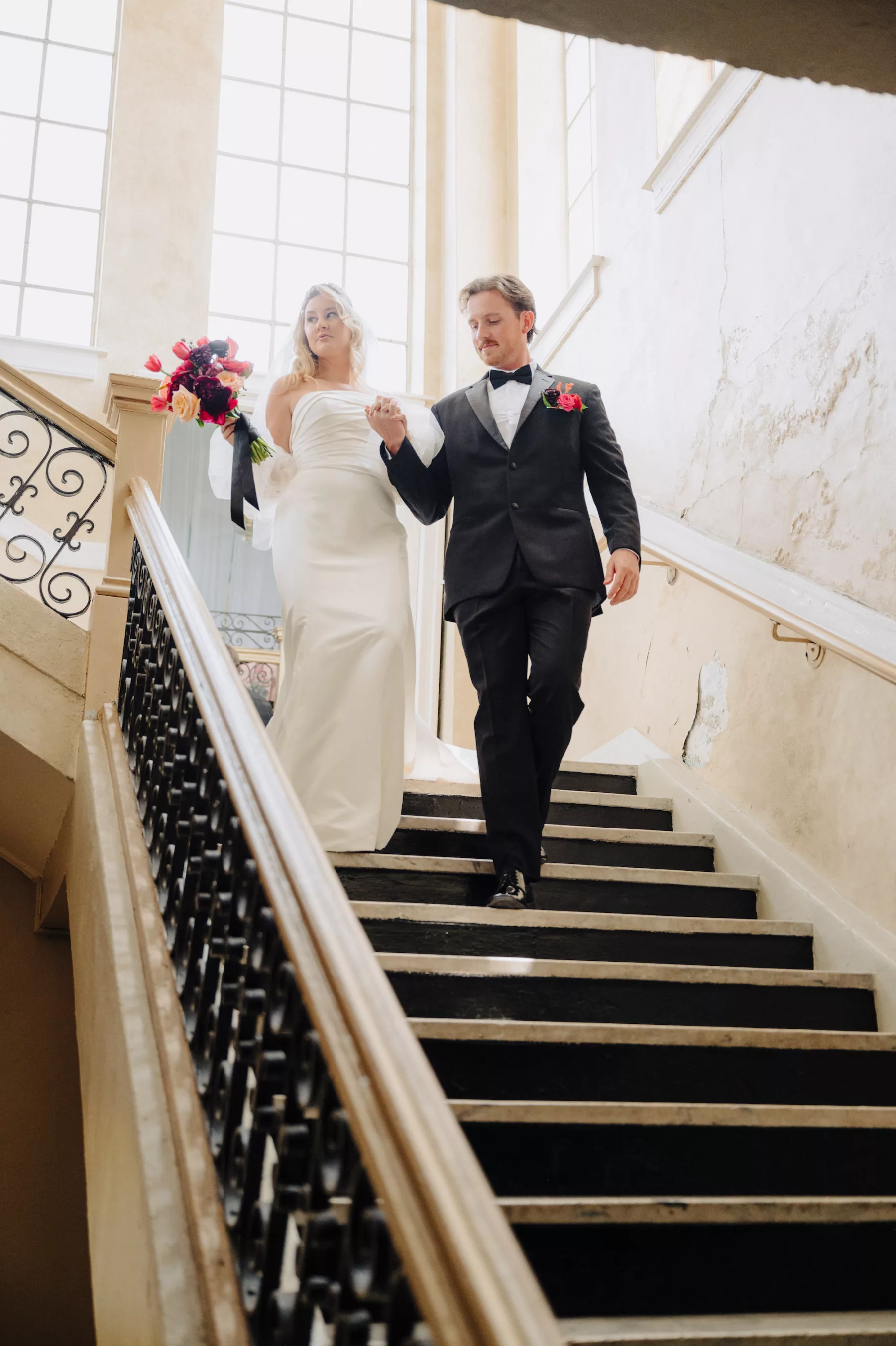 Bride and Groom Walking Down the Stairs Wedding Portrait | Tampa Bay Content Creator Behind The Vows