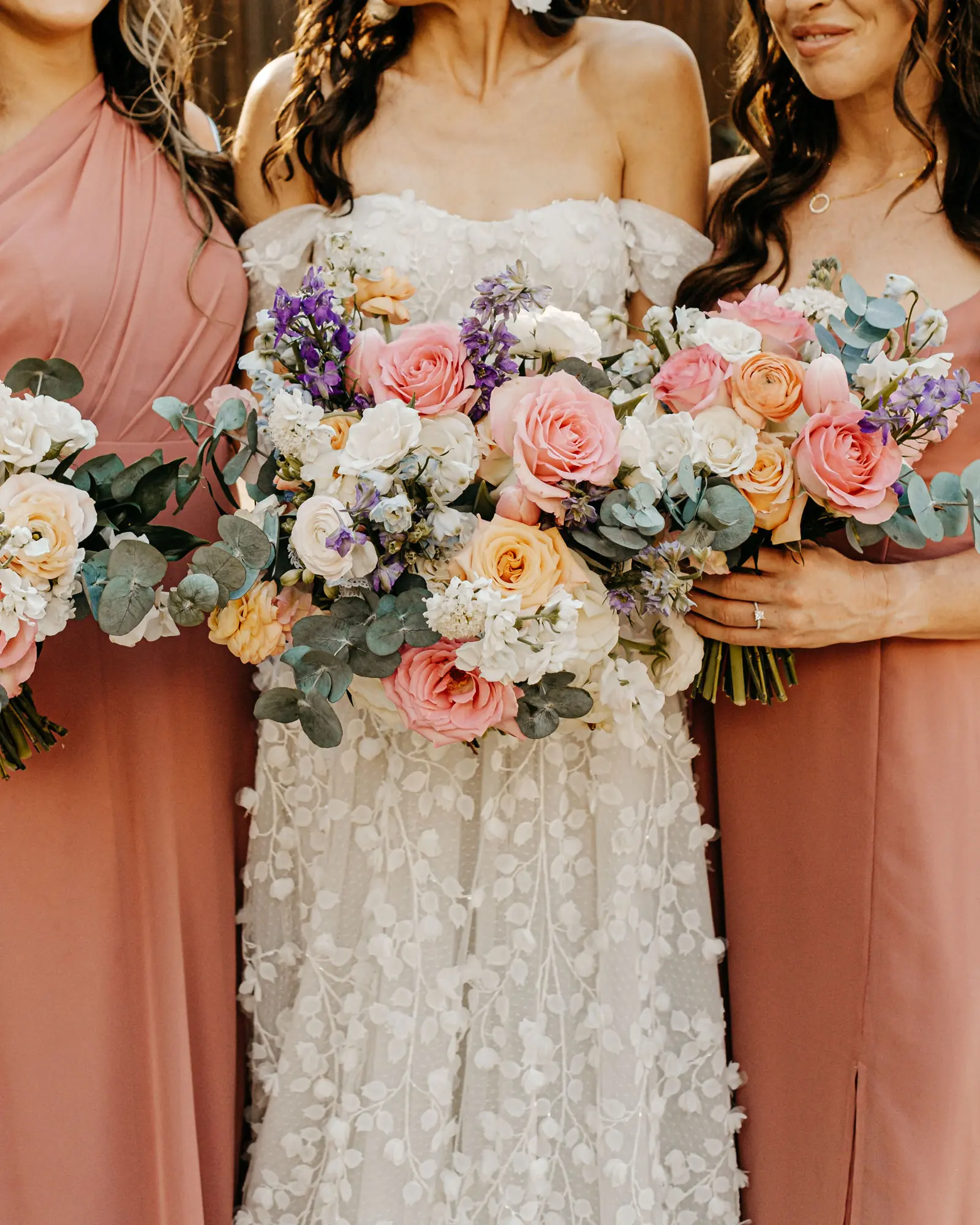 Spring Wedding Bouquet Ideas | Pink and Orange Roses, White Hydrangeas, Purple Flowers, and Greenery Floral Arrangement Inspiration | Tampa Bay Florist Monarch Events