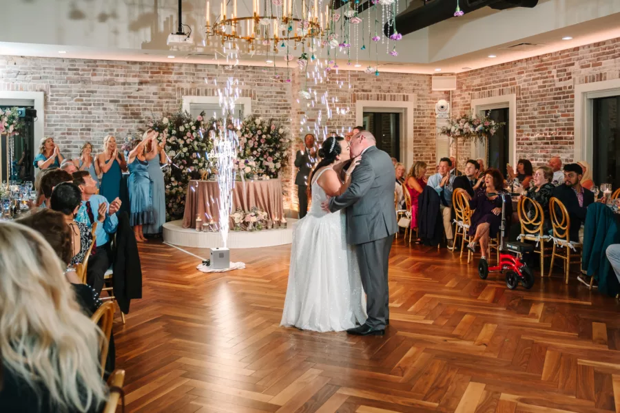 Bride and Groom First Dance Wedding Portrait | Cold Spark Machine Decor Entertainment Ideas | Industrial Tampa Bay Event Venue Red Mesa Events