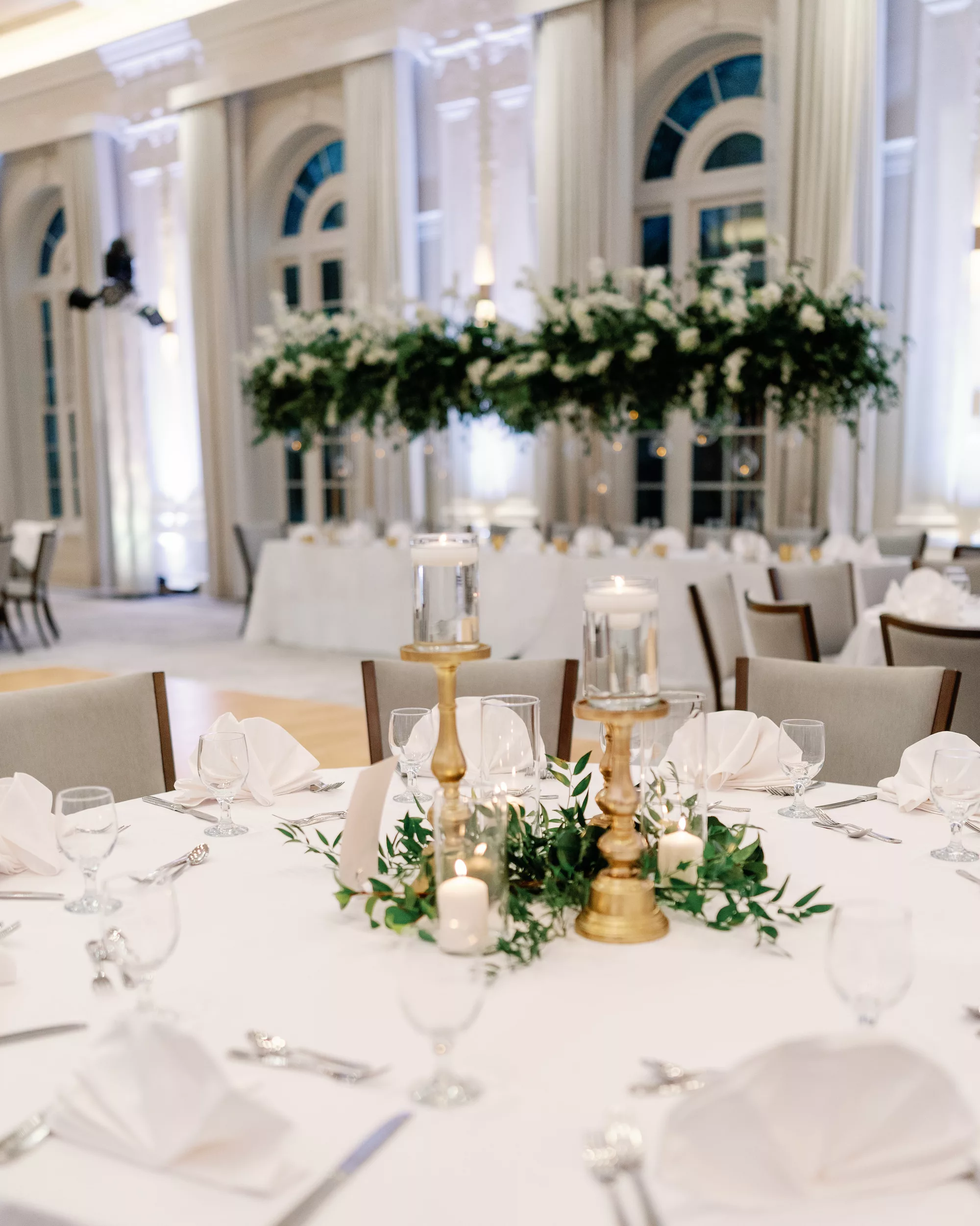 Luxurious White and Gold Grand Ballroom Wedding Reception Decor Ideas | Greenery Garland and Floating Candle Centerpiece Inspiration
