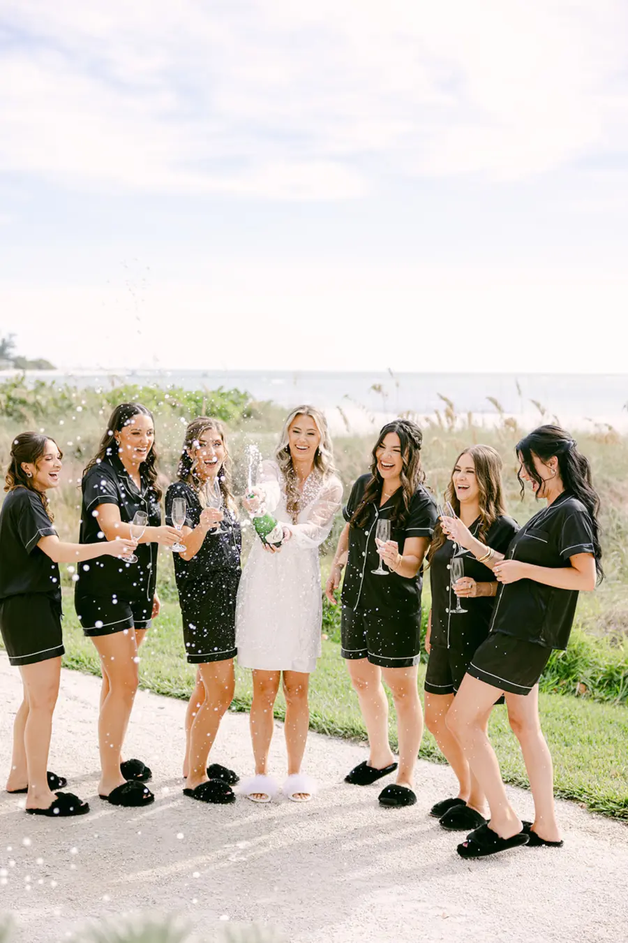 Bride and Bridesmaids Wedding Day Champagne Celebration | Matching Black Getting Ready Pajamas Ideas
