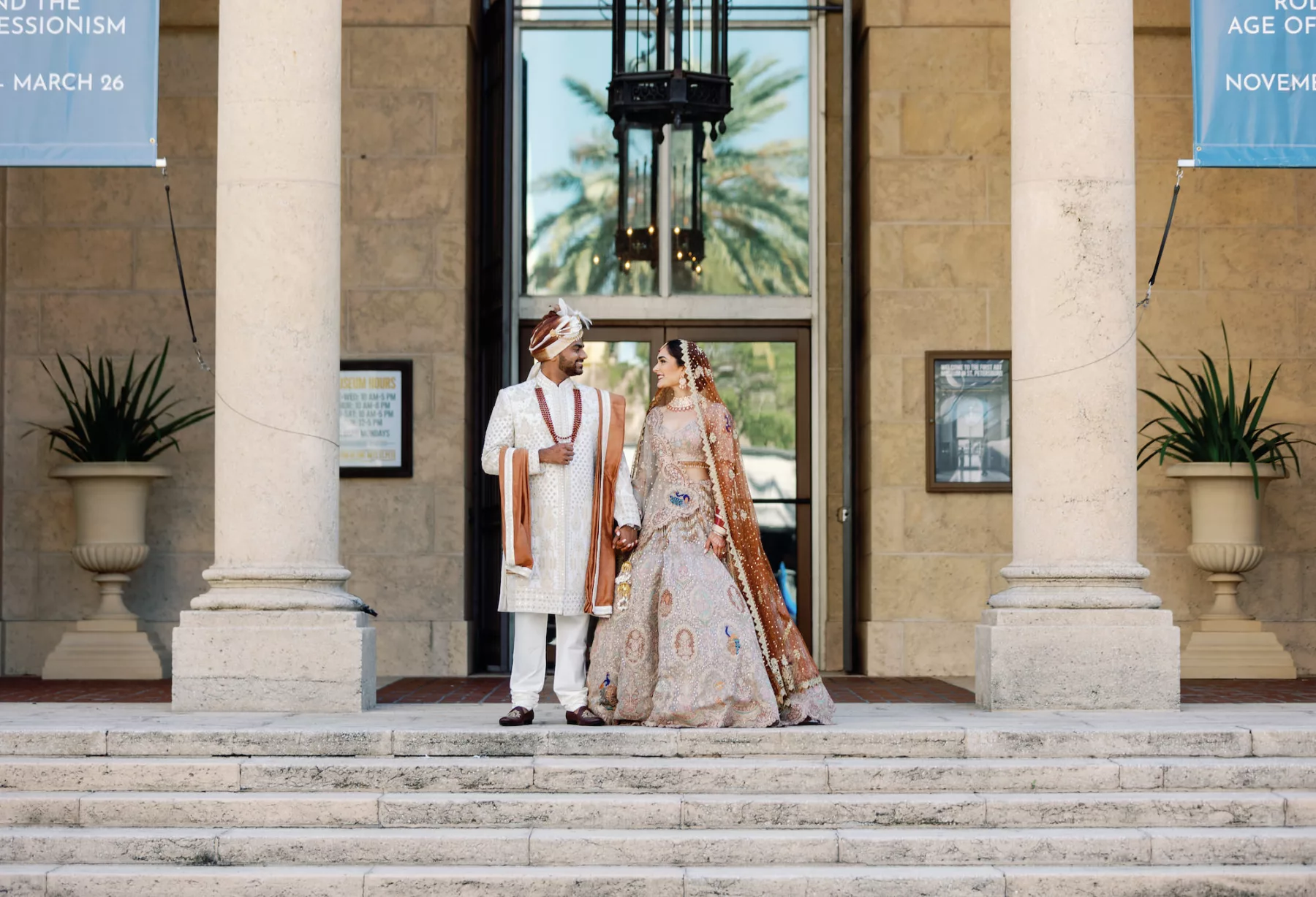 Bride and Groom First Look Wedding Portrait | Neutral Burnt Orange and Cream Beaded Rimple and Harpreet Lehenga Indian Wedding Dress Inspiration | White and Brown Groom's Sherwani Wedding Attire Ideas | St Pete Event Venue Museum of Fine Arts | Hair and Makeup Artist Michele Renee The Studio | Planner Coastal Coordinating