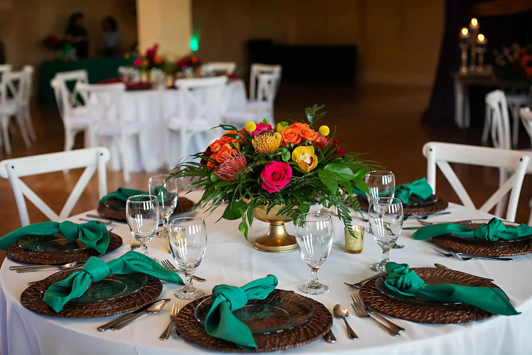 Colorful Tropical Wedding Reception Centerpiece Place Setting Tablescape Inspiration | Orange Pincushion Protea, Pink and Red Roses, Ferns and Greenery Floral Arrangement Ideas