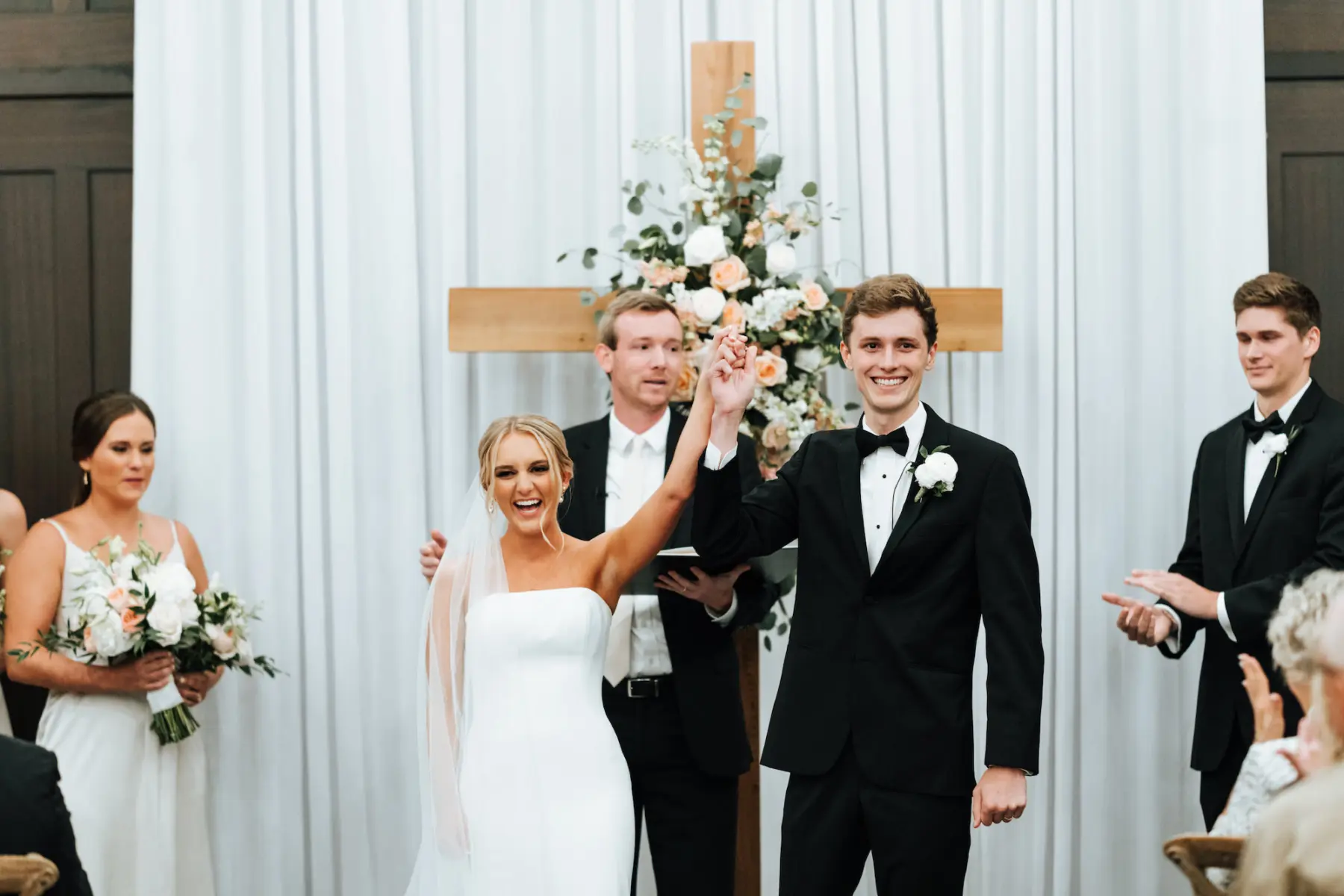 Classic White and Greenery Wedding Ceremony Floral Inspiration with Cross at Altar