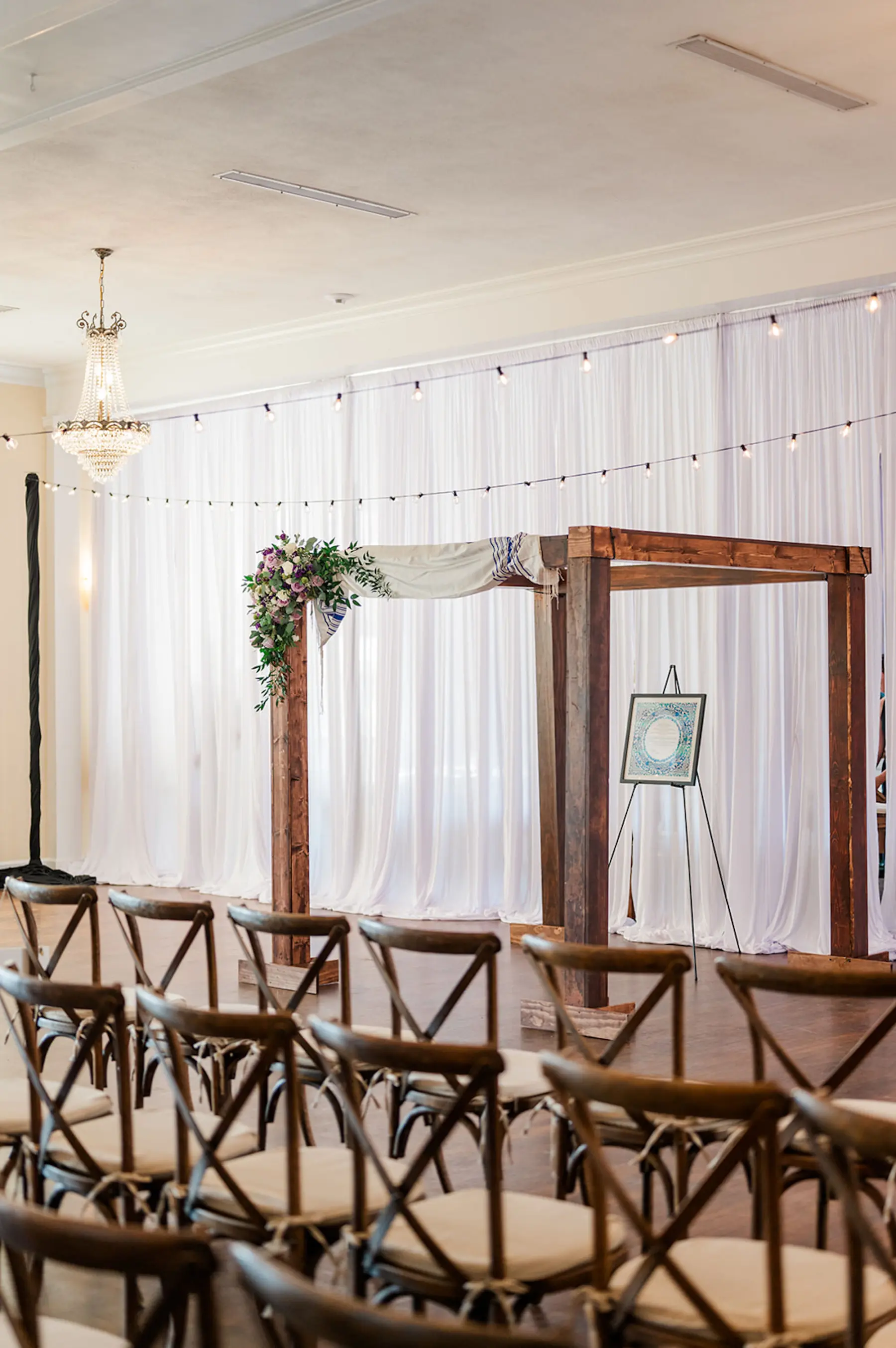 Elegant Wooden Wedding Jewish Ceremony Chuppah Arch with Purple Spring Floral Inspiration and Crossback Chairs