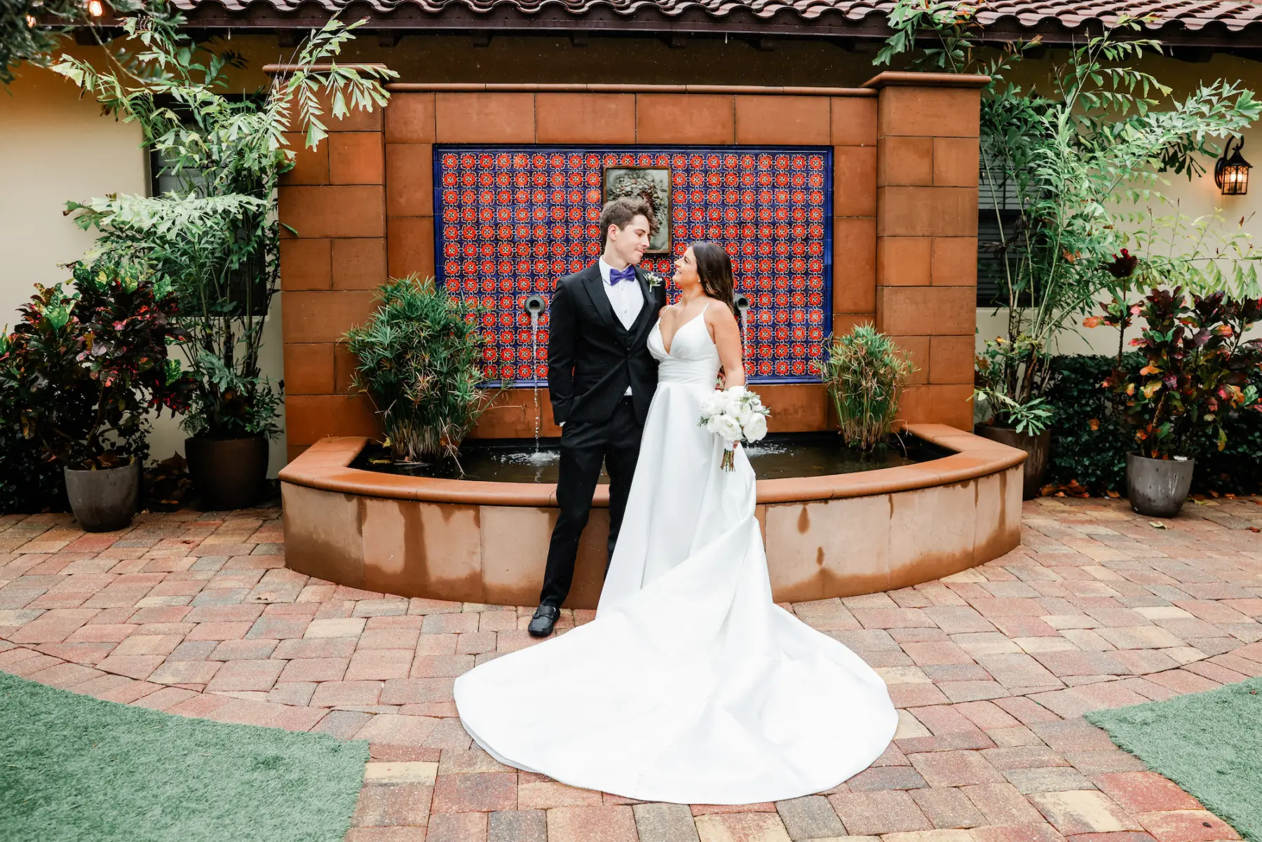 Bride and Groom Spanish Inspired Courtyard Fountain Wedding Portrait | Tampa Bay Event Venue Mision Lago Estate