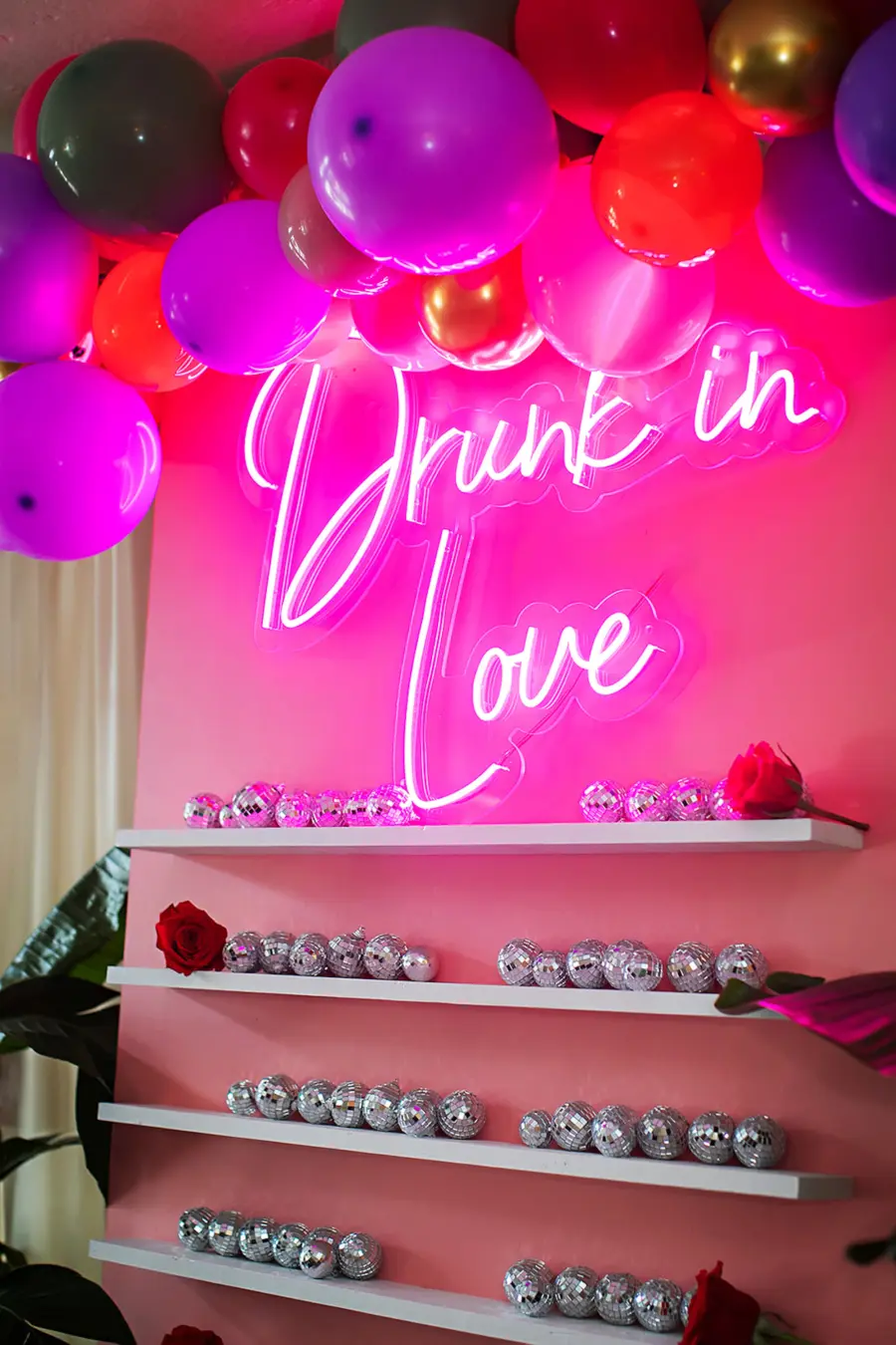 Whimsical Drunk In Love Neon Sign Wedding Reception Seating Chart Display Ideas | Disco Ball and Balloon Arch Decor Inspiration