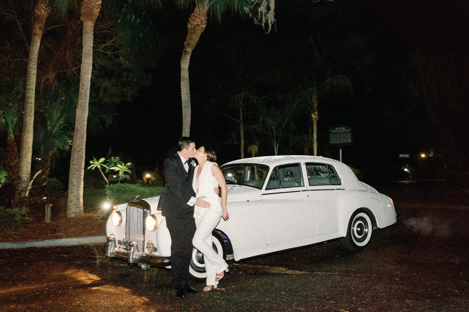 Bride and Groom with Classic Rolls Royce Getaway Car Indeas