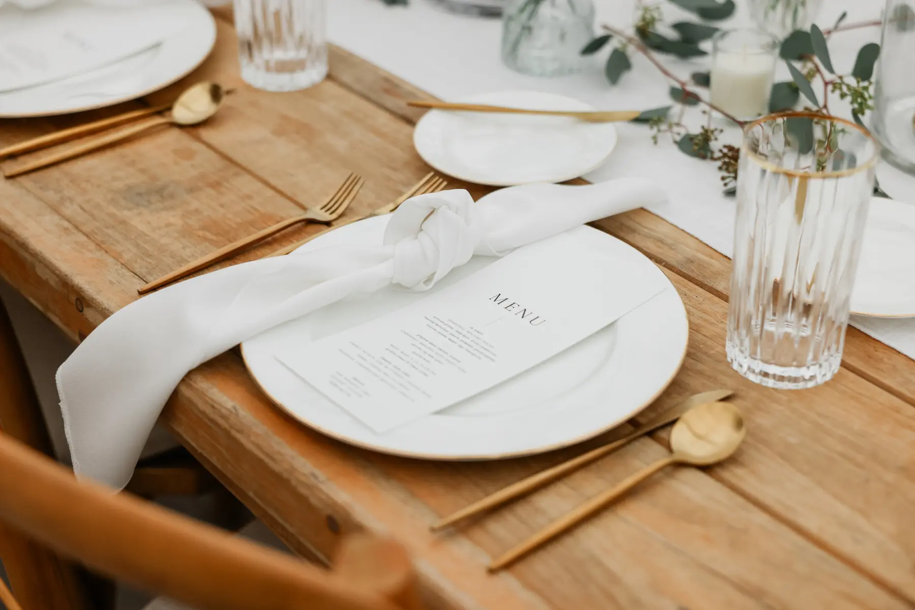 Classic White and Gold Wedding Reception Place Setting Inspiration | Gold Flatware | Modern Black and White Menu Cart | Ribbed Gold Rimmed Glass |Tampa Bay Kate Ryan Event Rentals