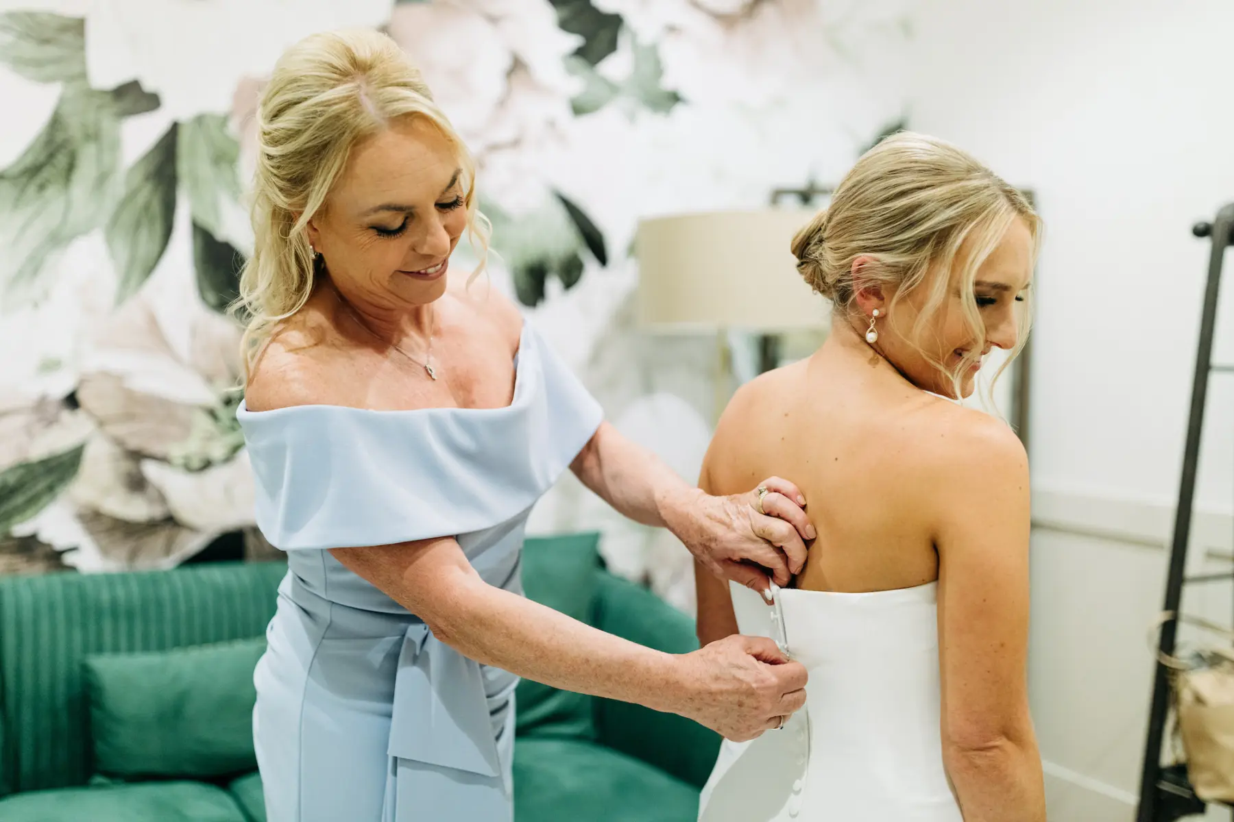Bride Getting Dressed with Mother on Wedding Day Portrait
