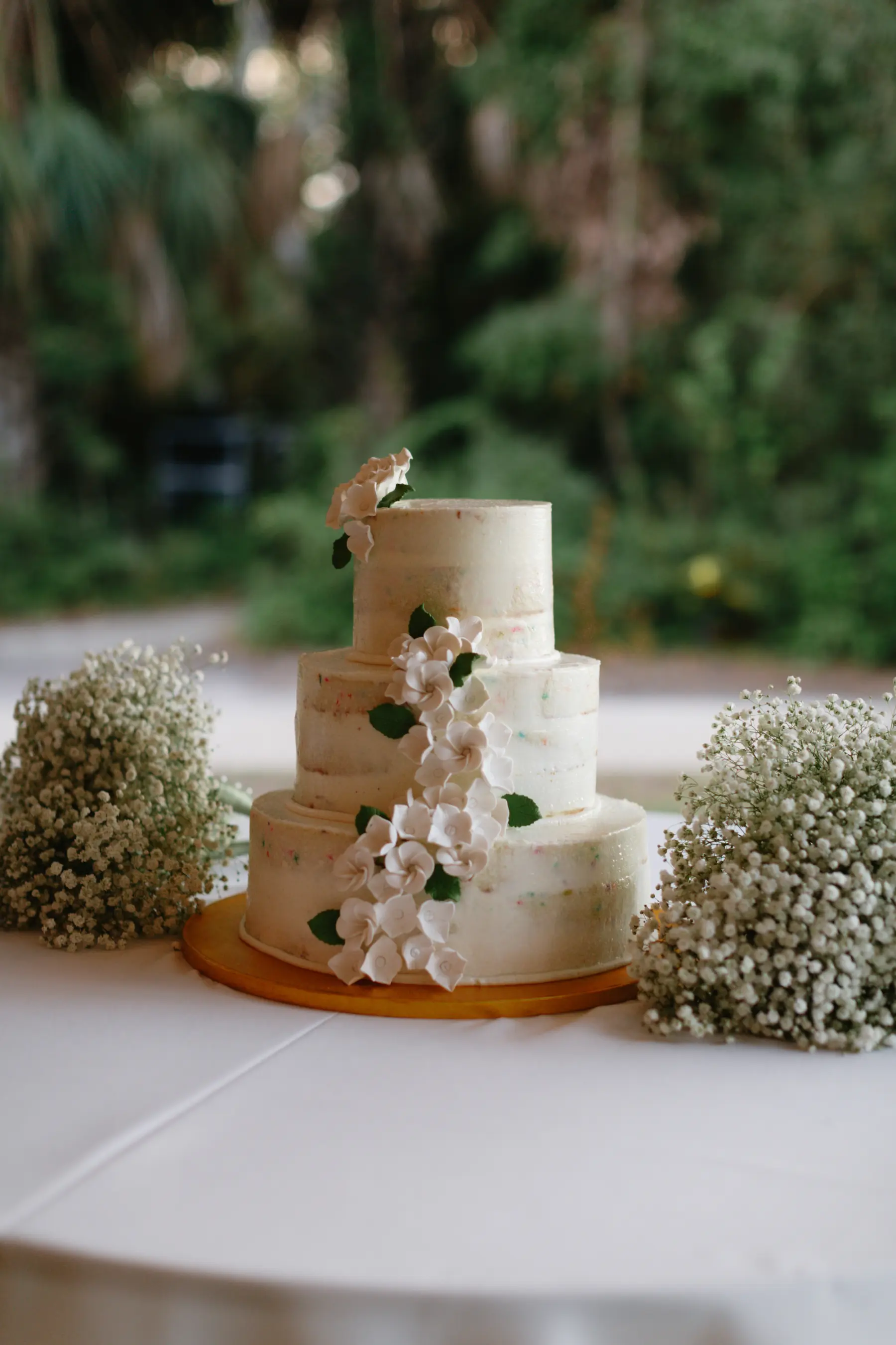 Semi-Naked White Round Three-Tiered Wedding Cake with White Orchid Accent Inspirations