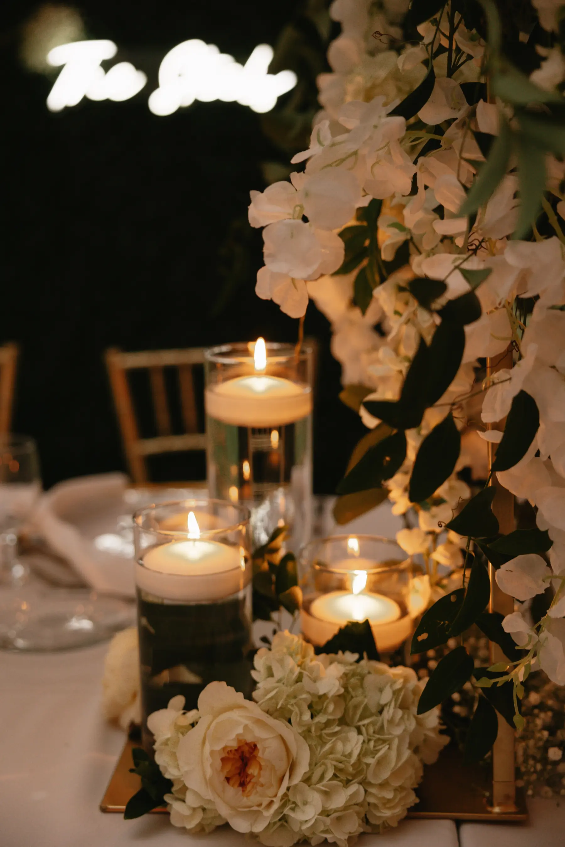 Classic White Orchid, Garden Rose, and Hydrangea, Floating Candle Centerpiece Decor Ideas | Tampa Bay Florist Beneva Florals