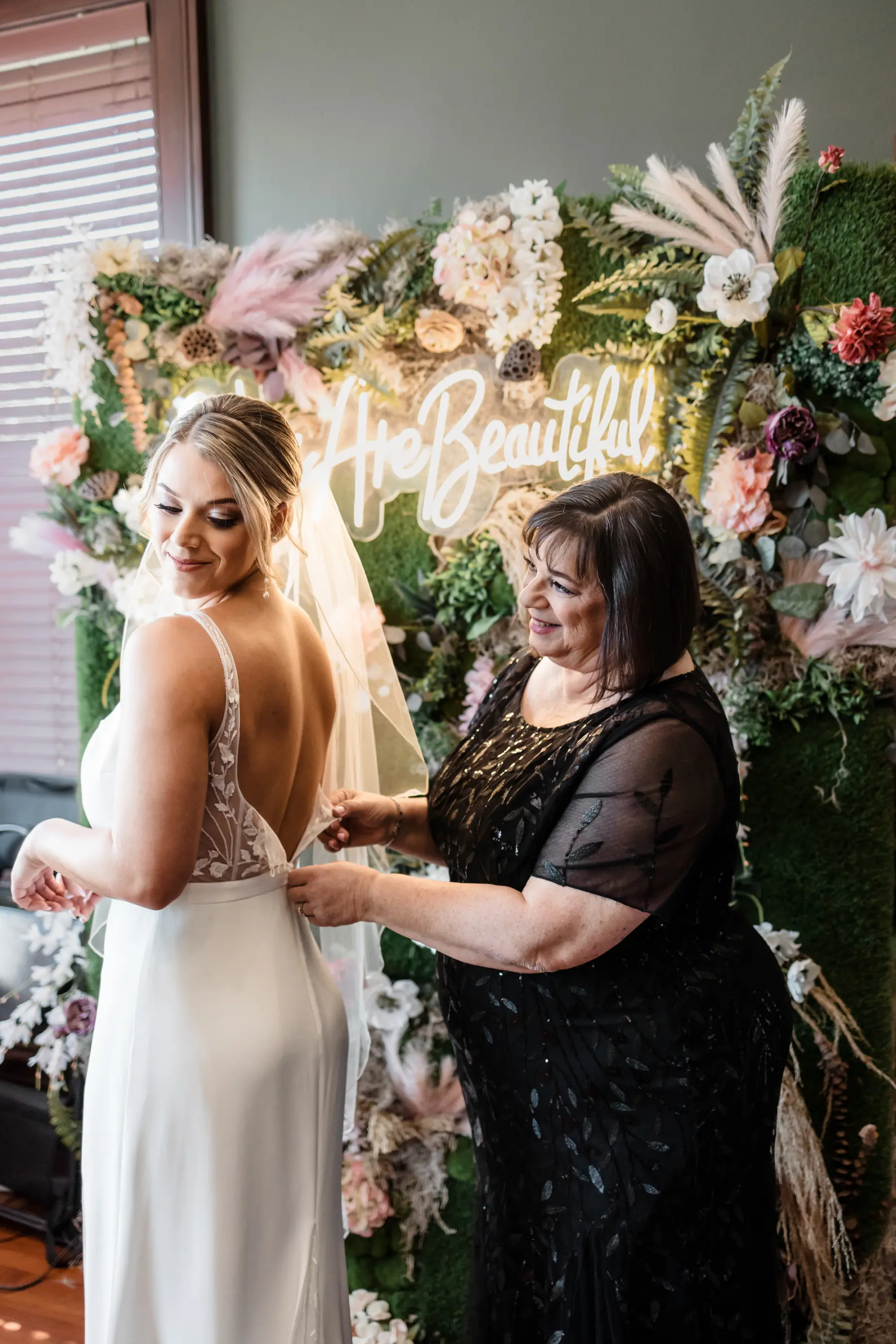 Bride and Mother Getting Ready Wedding Portrait | Black Mother of the Bride Dress Ideas | Classic White Open Back Lace Fit and Flare Square Neck Alexandra Grecco Wedding Dress with Side Slit Inspiration | Tampa Bay Hair and Makeup Artist Adore Bridal Services