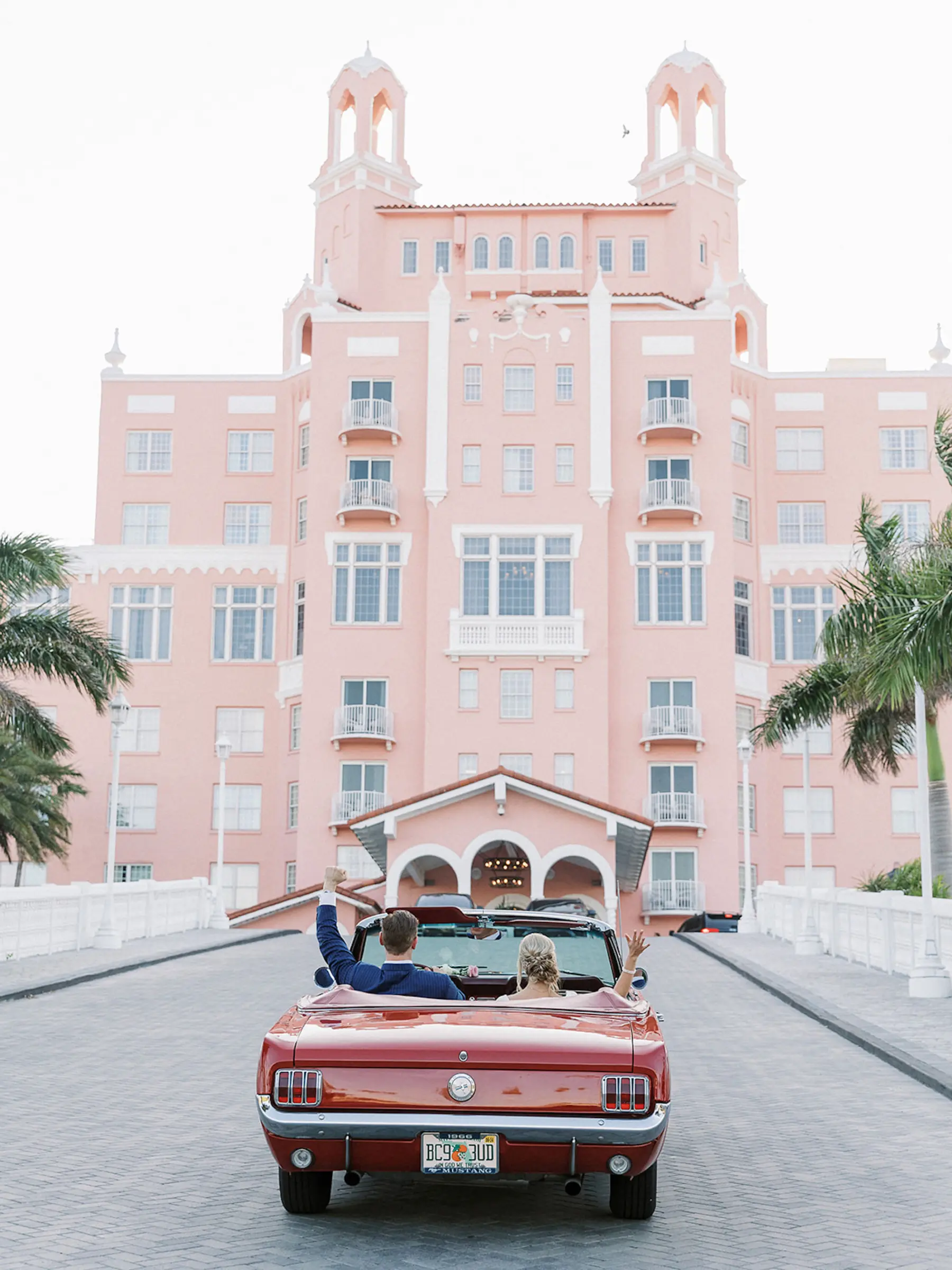 Bride and Groom Just Married Wedding Portrait | Red Convertible Classic Mustang Getaway Car Ideas | St Pete Event Venue Don CeSar | Tampa Bay Planner Unique Weddings and Events