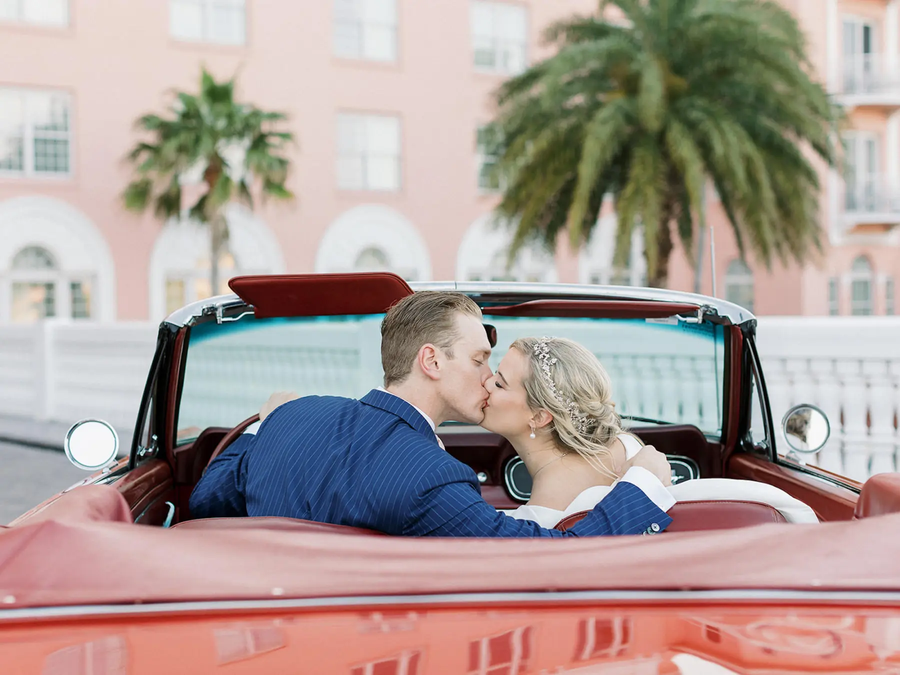 Bride and Groom Just Married Wedding Portrait | Red Convertible Classic Mustang Getaway Car Ideas | Tampa Bay Planner Unique Weddings and Events