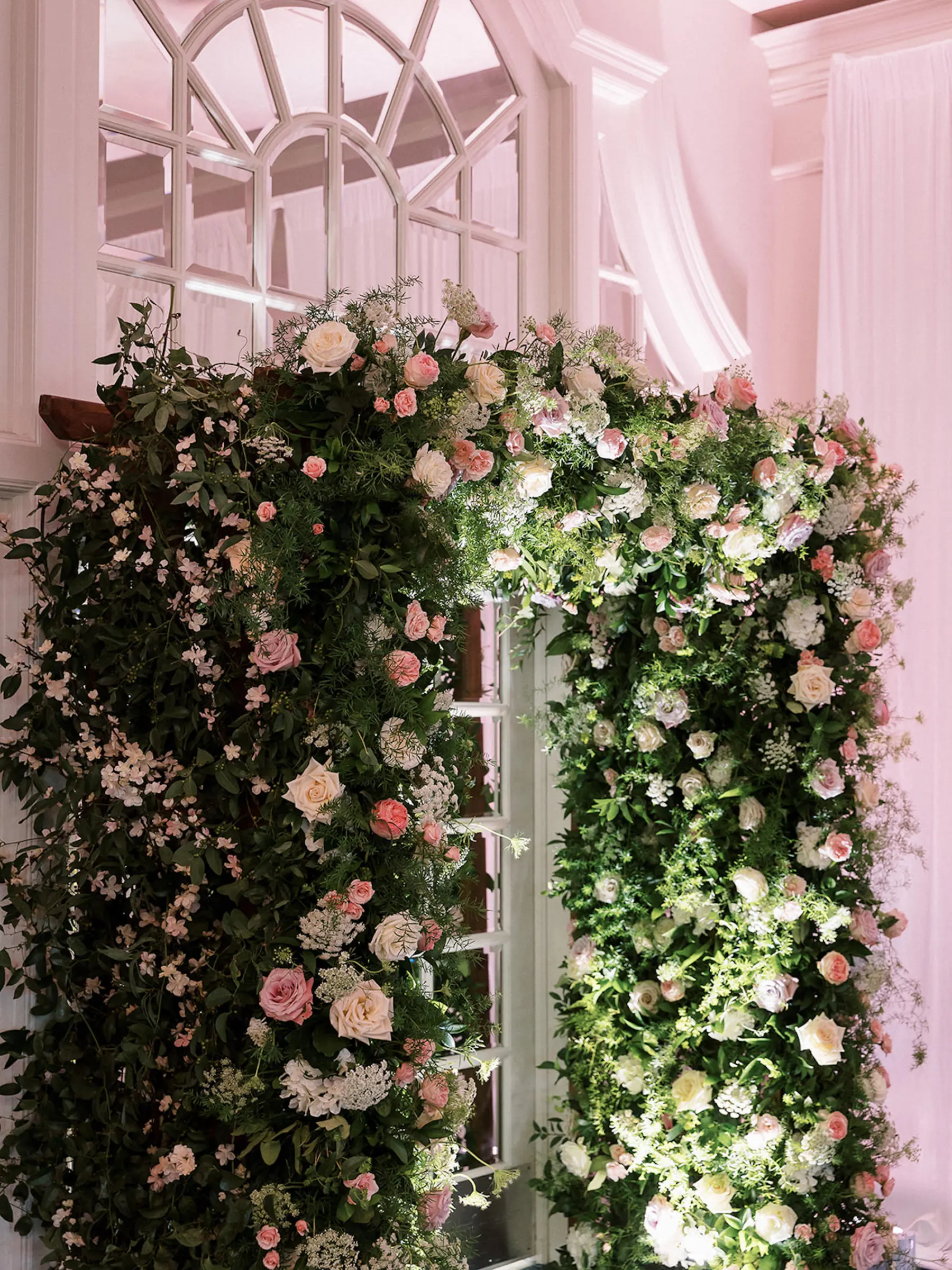 Whimsical Wedding Reception Entrance Arch Decor Ideas | White and Pink Roses, Greenery Floral Arrangement Inspiration