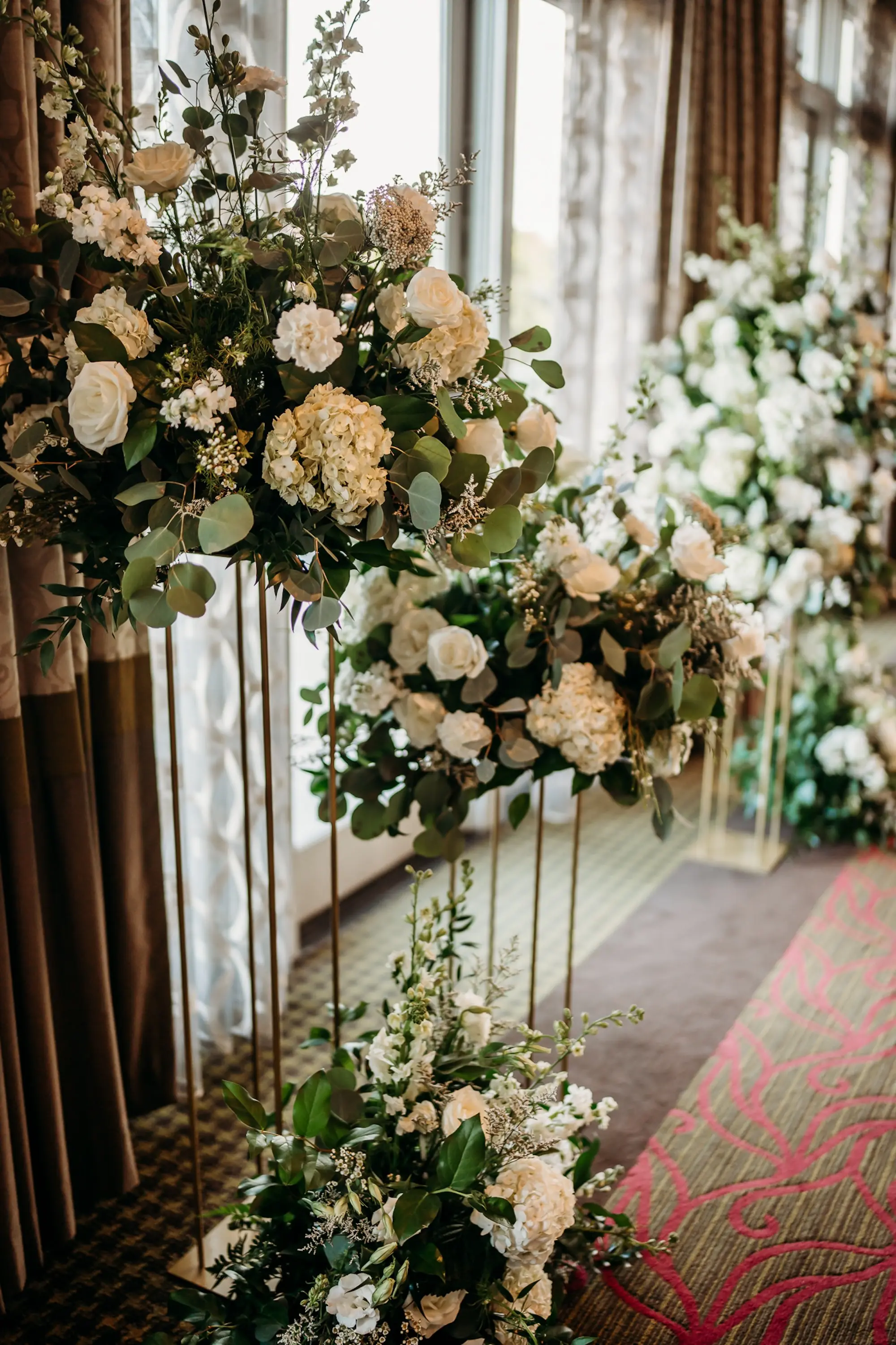 Timeless Whites Roses, Hydrangeas, And Greenery Wedding Ceremony Altar Decor Inspiration