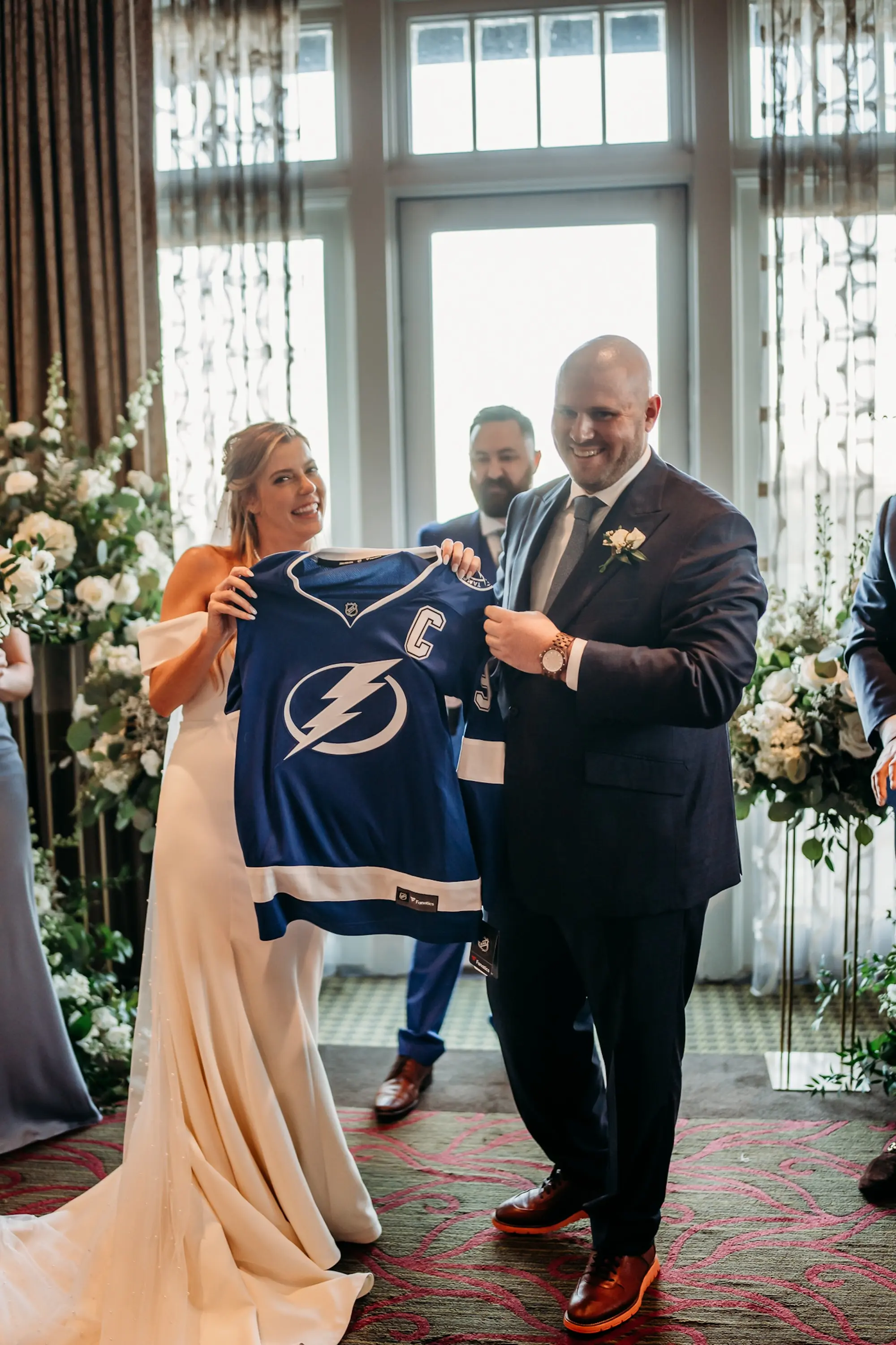 Bride and Groom with Lightning Captains Jersey at Alter Wedding Ceremony Portrait