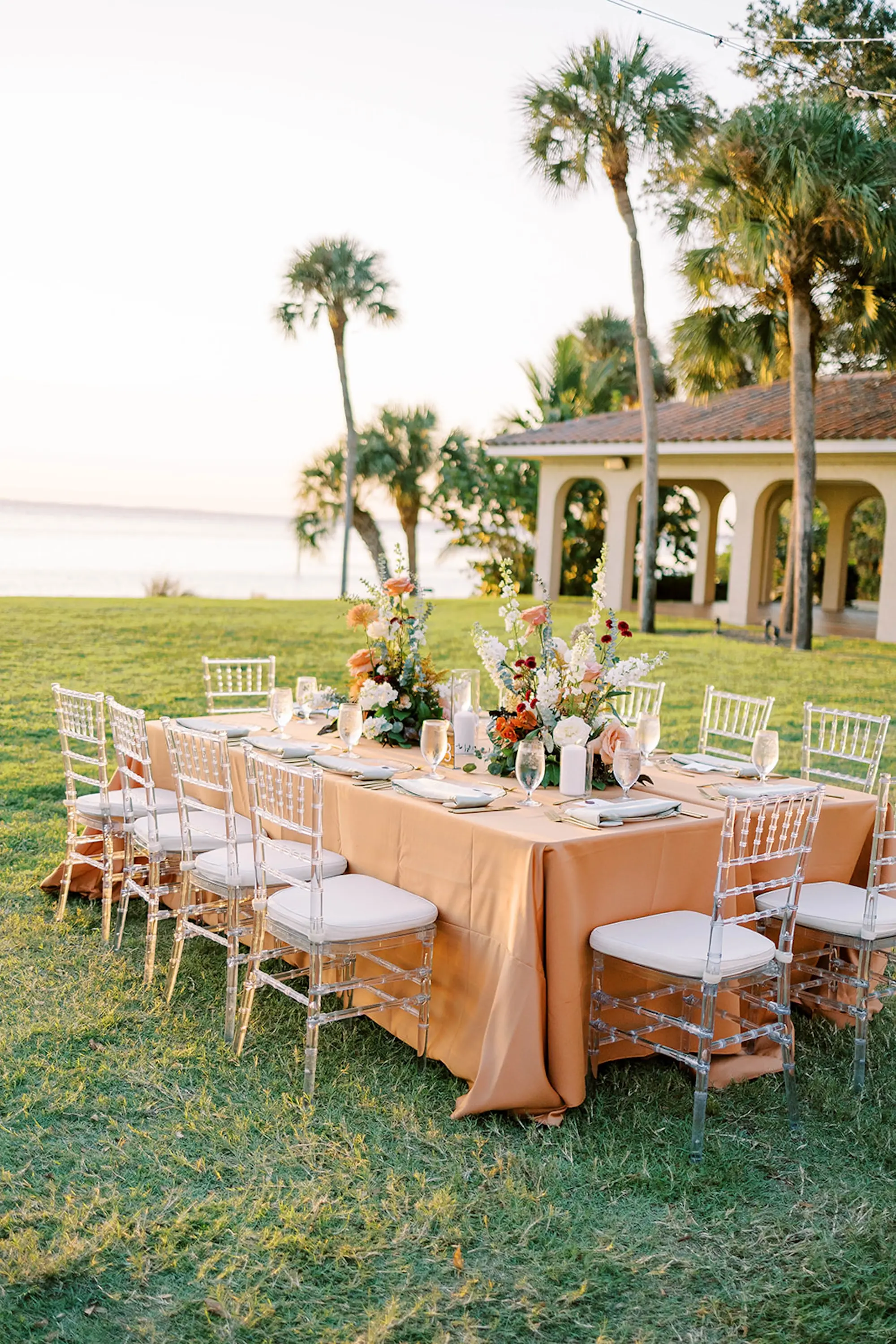 Romantic Neutral Outdoor Fall Wedding Reception Decor Ideas | Clear Chiavari Chairs, Peach Tablecloths | Sarasota Event Venue Powel Crosley Estate