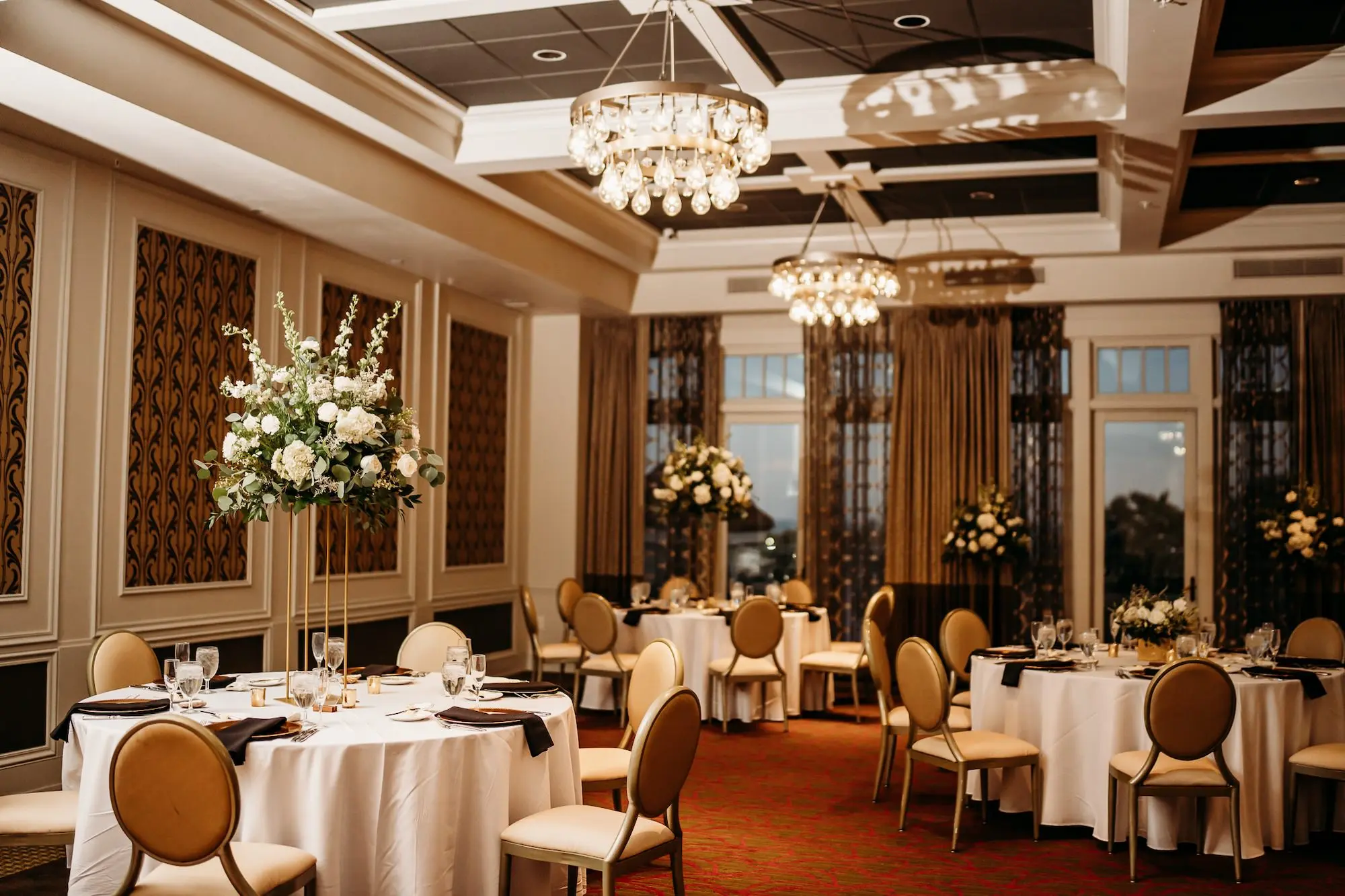 Luxurious Grand Ballroom Wedding Reception | Modern Gold and Cream Chairs | Tall Gold Centerpieces with White Hydrangeas, Roses, and Snapdragons Flower Arrangement Ideas | Tampa Bay Planner Blue Skies Weddings and Events