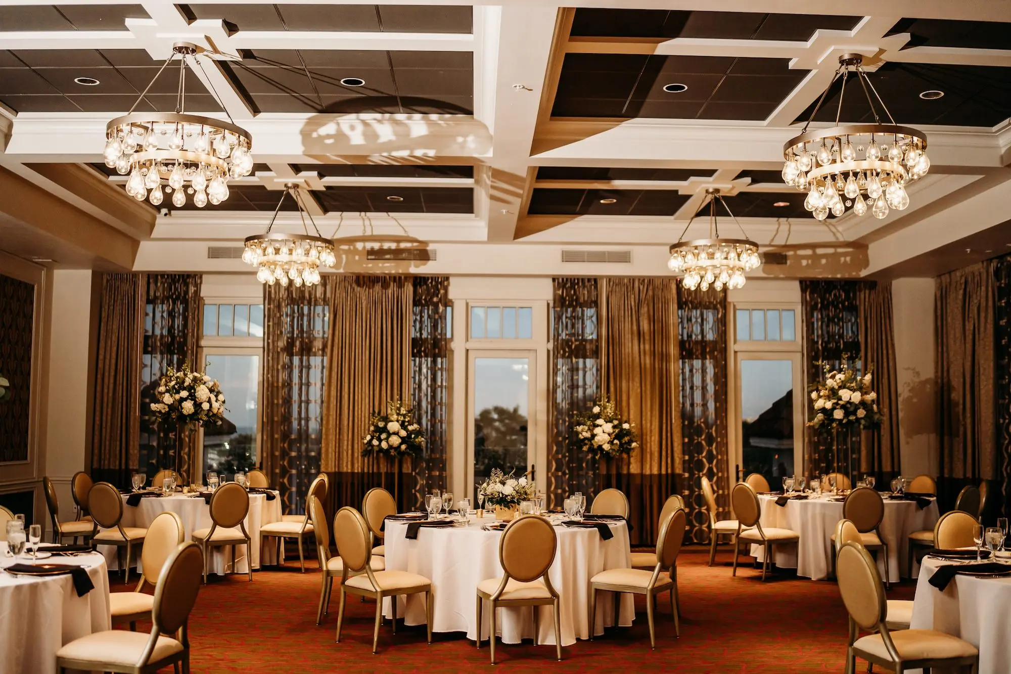 Luxurious Grand Ballroom Wedding Reception | Modern Gold and Cream Chairs | Tall Gold Centerpieces with White Hydrangeas, Roses, and Snapdragons Flower Arrangement Ideas | Tampa Bay Planner Blue Skies Weddings and Events | Downtown St. Pete Boutique Hotel Wedding Venue The Birchwood
