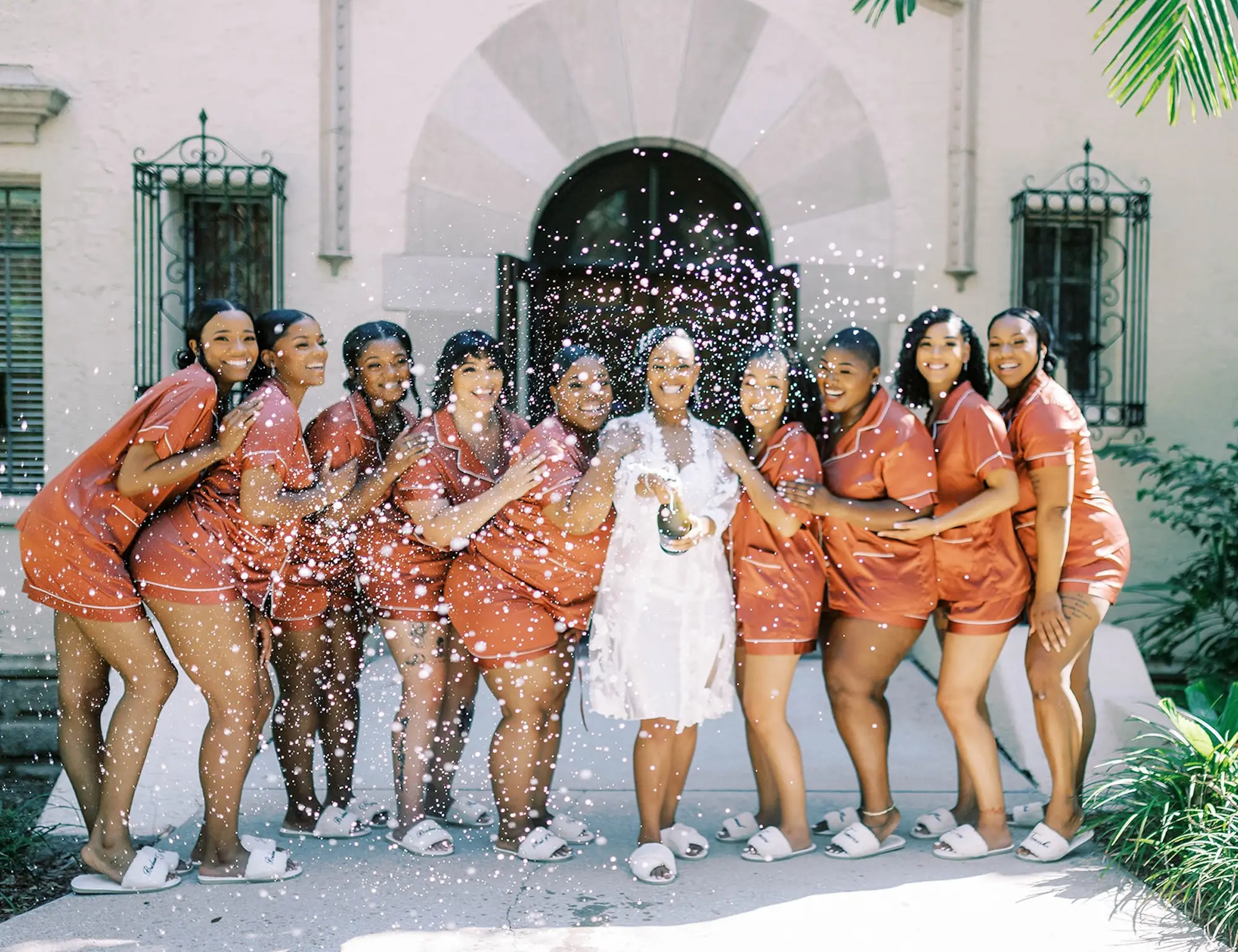 Bride and Bridesmaid Getting Ready Wedding Portrait | Matching Orange Pajama Set Ideas
