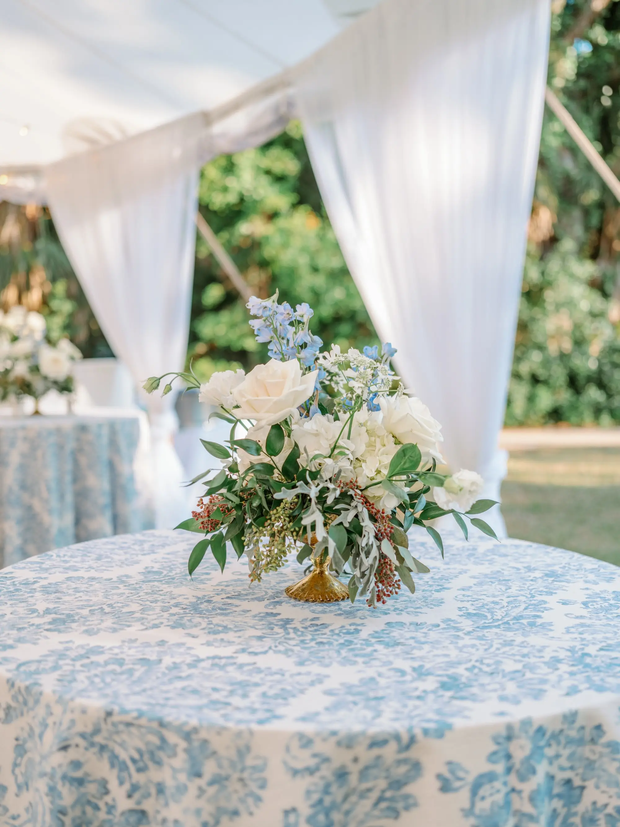 Luxurious Blue Spring Garden Tented Wedding Reception Tabletop Decor Ideas | Blue and White Flowers, and Greenery | Sarasota Florist Beneva Flowers
